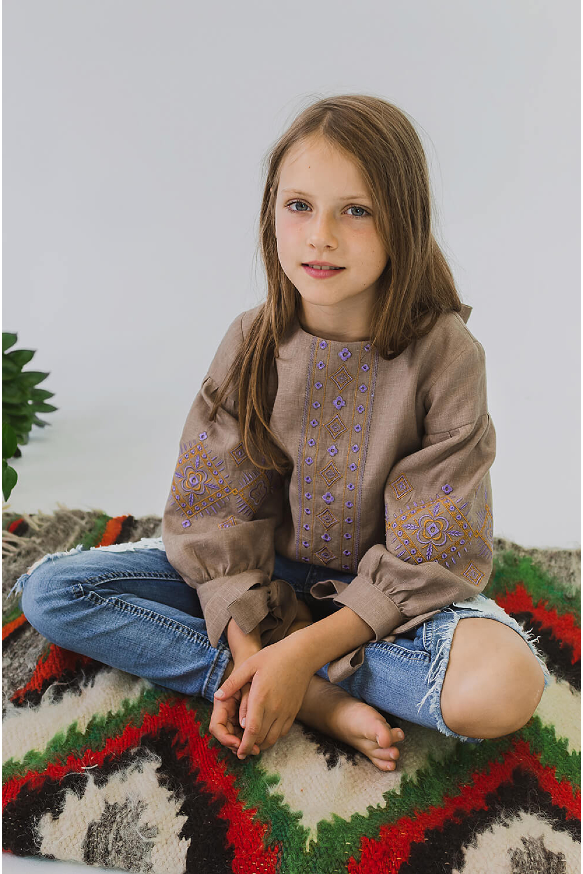 Embroidered blouse for a girl with bsuffe bows Embroidered blouse for a girl with bsuffe bows
