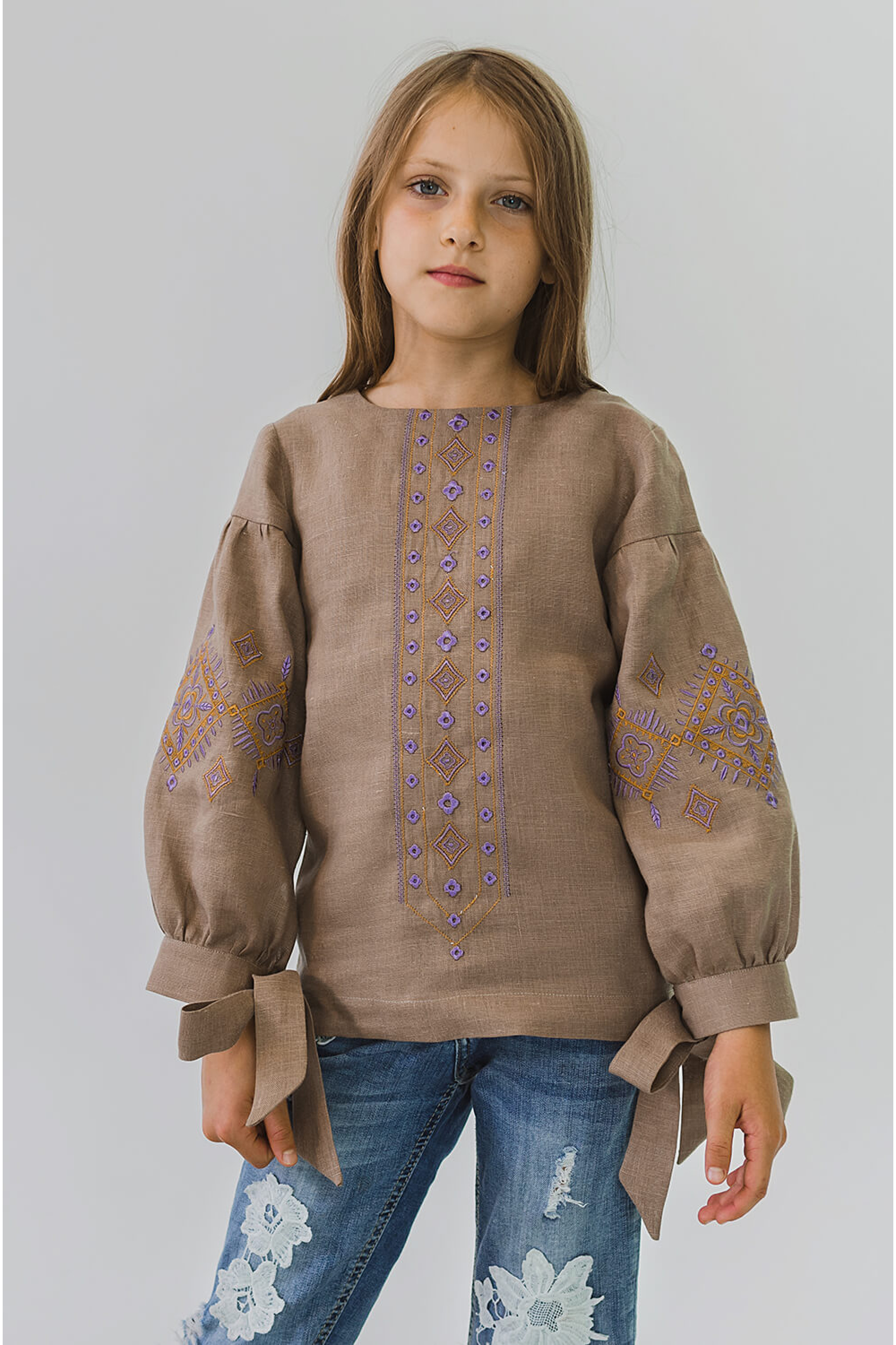 Embroidered blouse for a girl with bsuffe bows Embroidered blouse for a girl with bsuffe bows