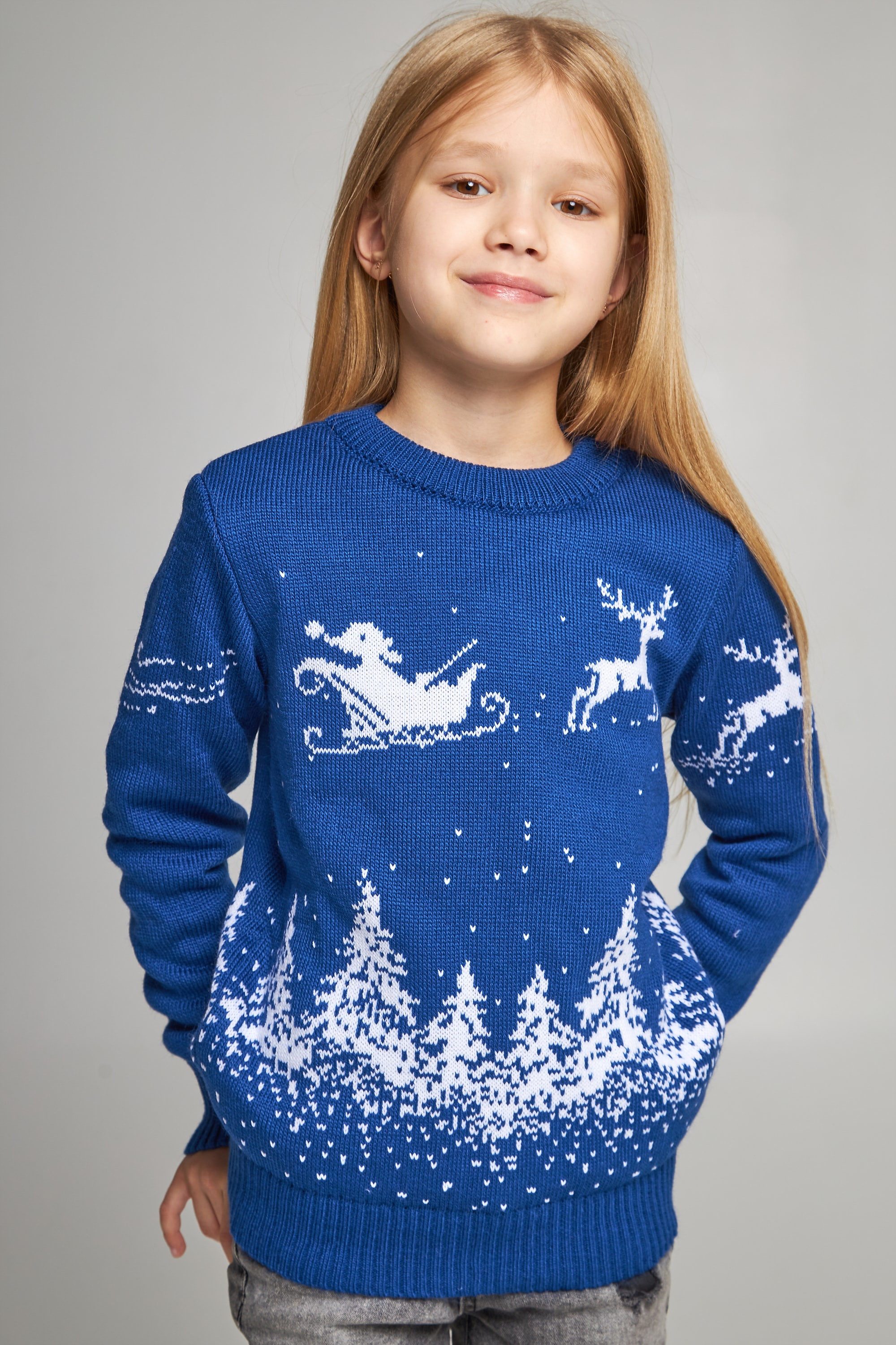 Knitted sweater for a girl Santa Claus with deer blue
