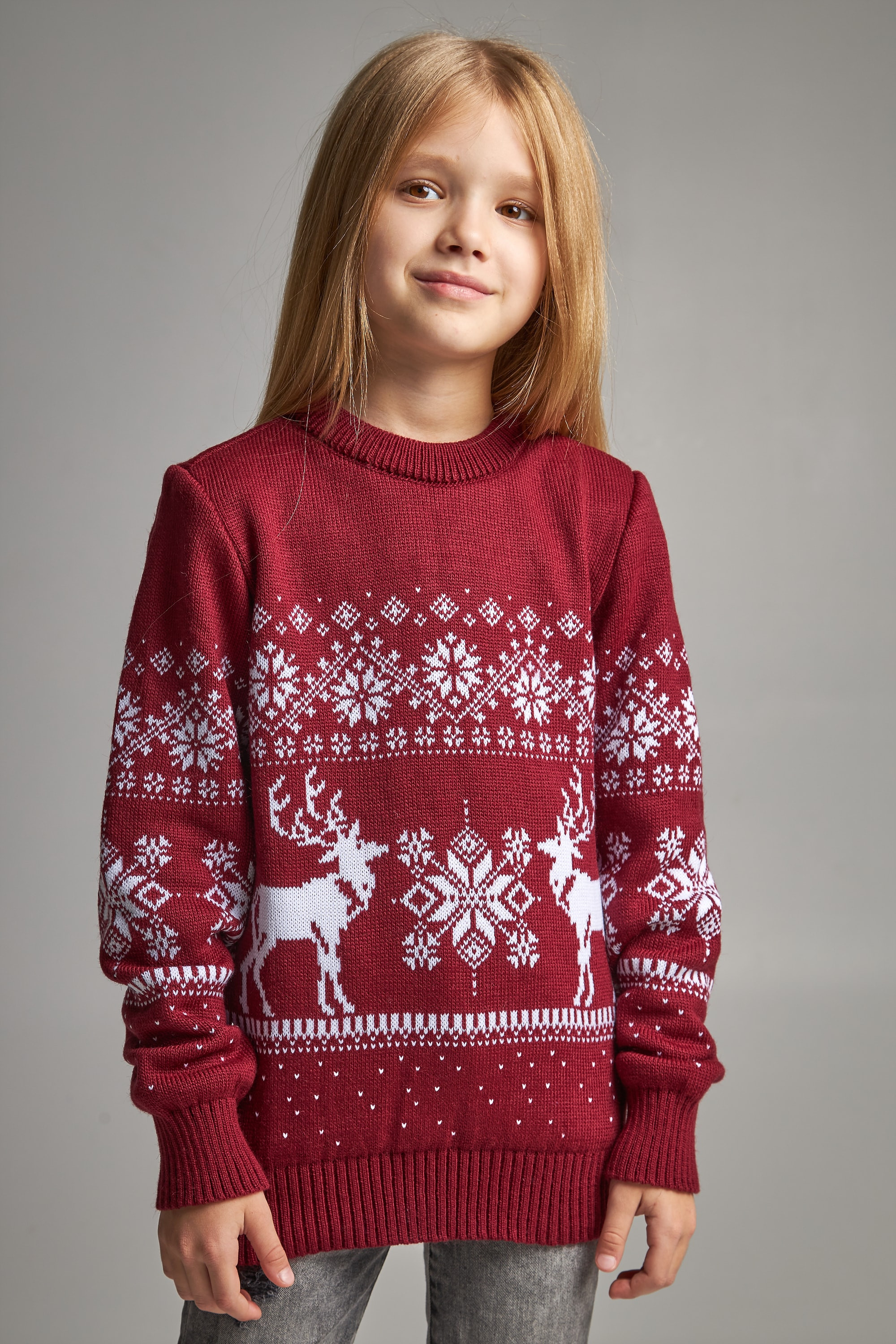 Knitted sweater for a girl snowflakes with deer burgundy