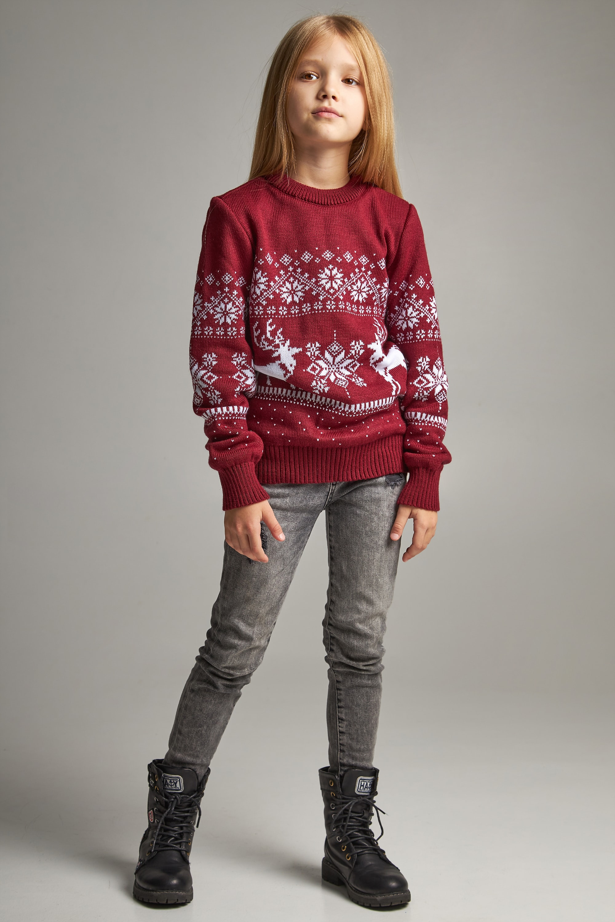 New Year's knitted children's sweaters for two Santa Claus with deer burgundy