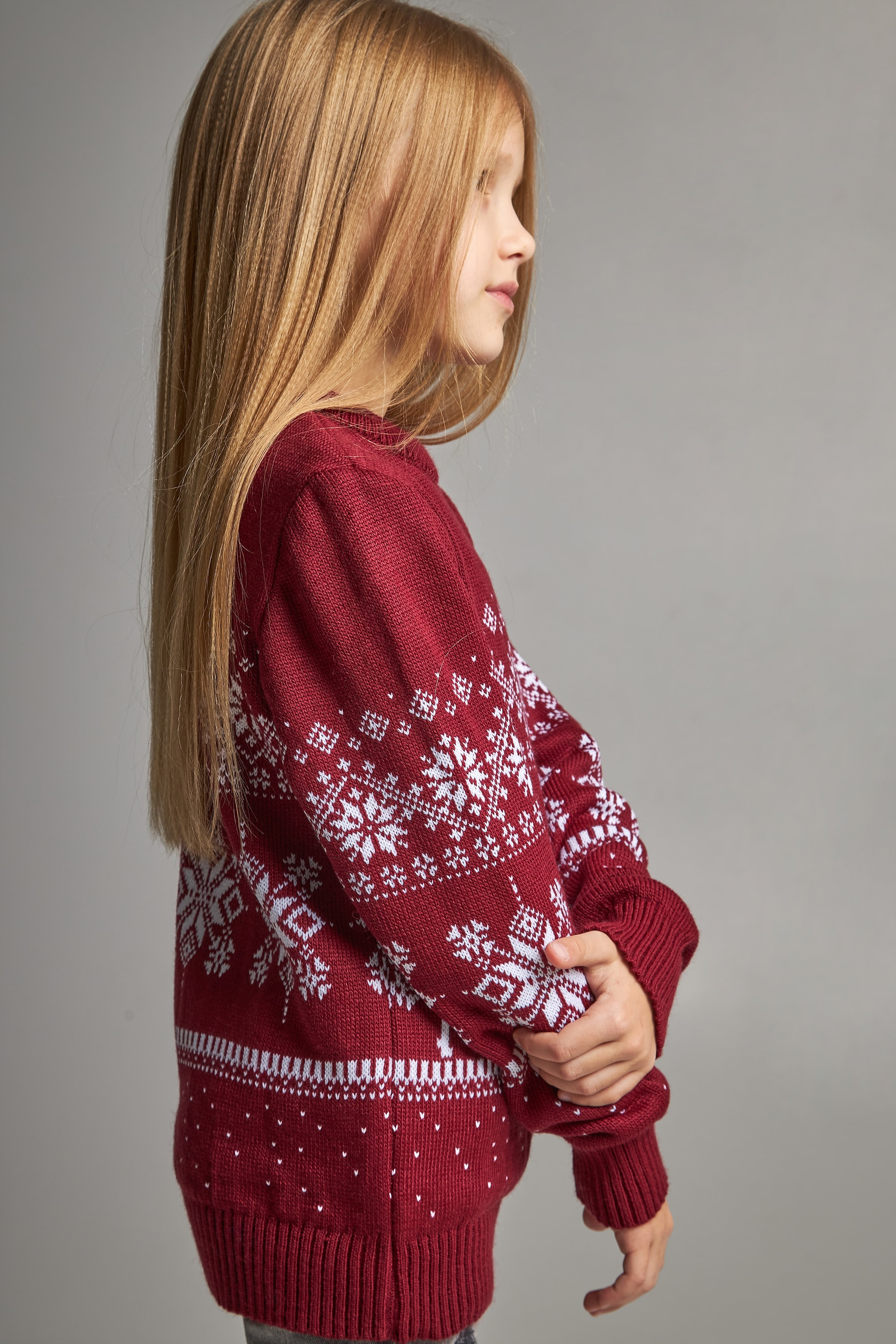 Knitted sweater for a girl snowflakes with deer burgundy