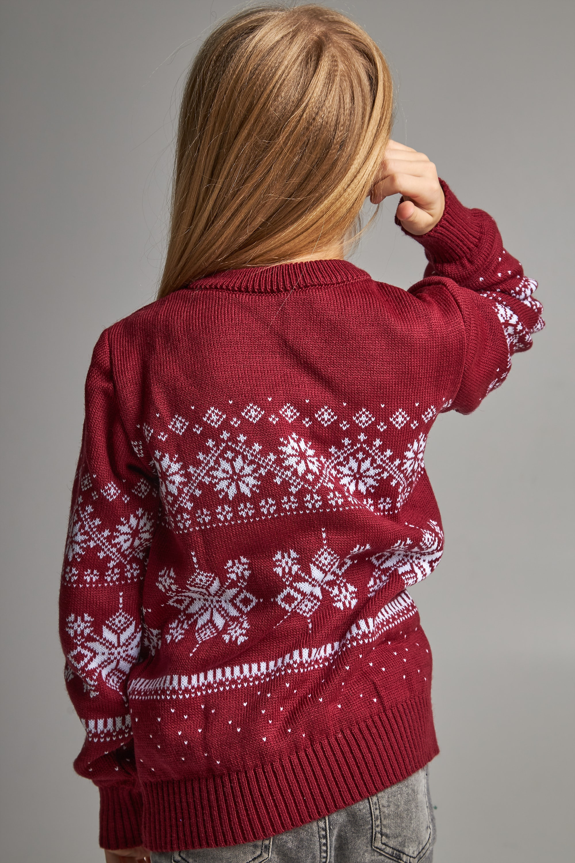 Knitted sweater for a girl snowflakes with deer burgundy