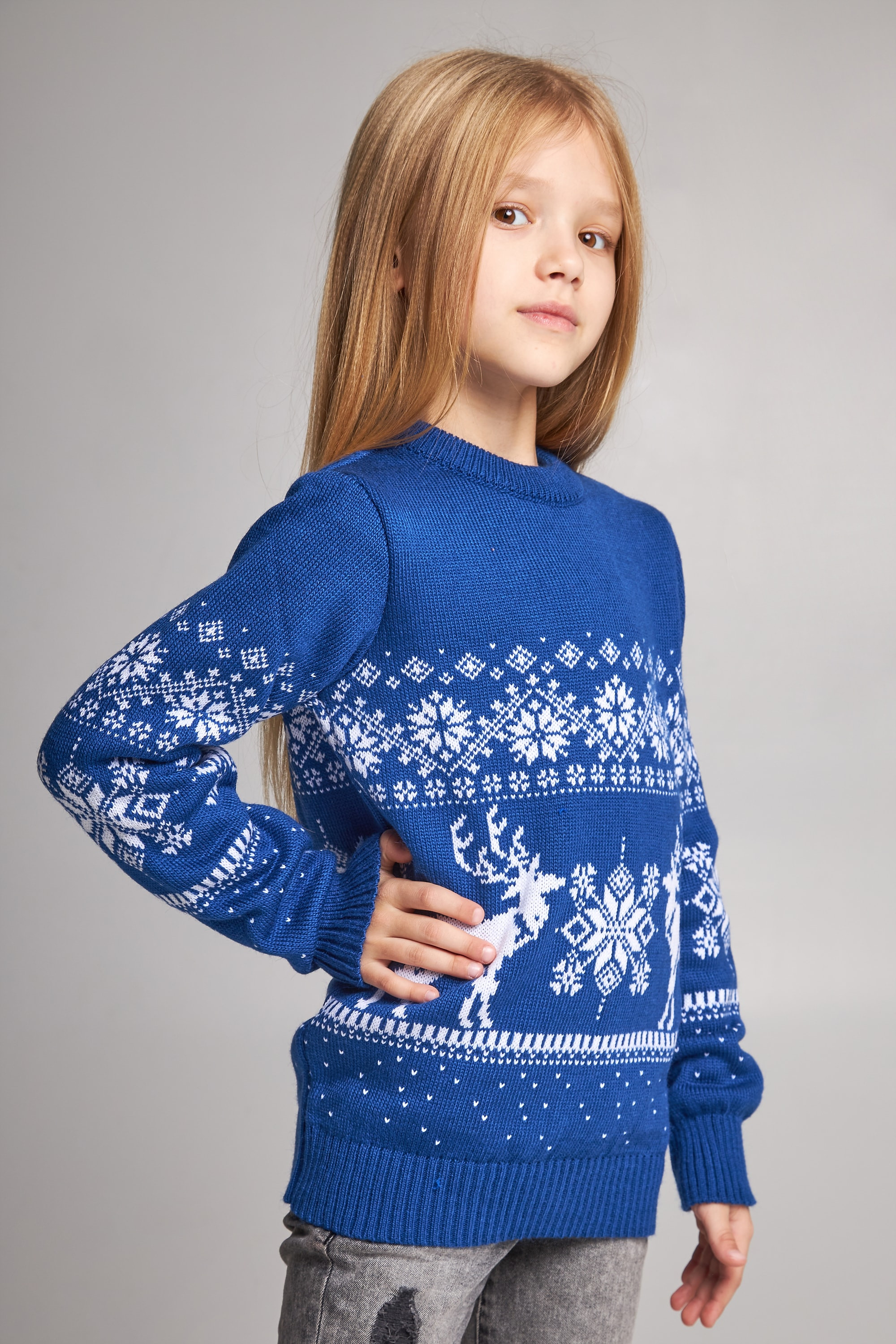 Knitted sweater for a girl snowflakes with deer blue