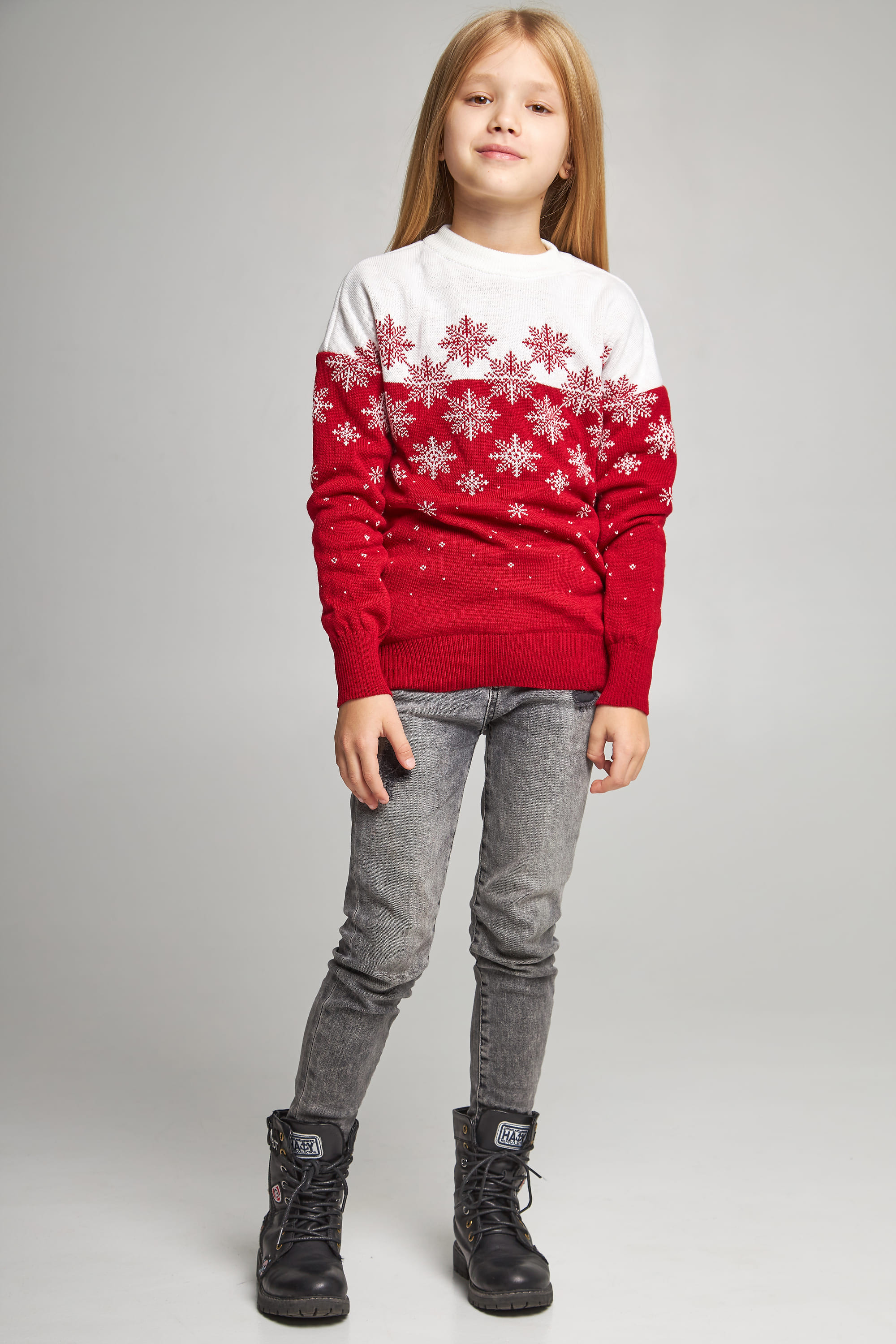 Knitted sweater for a girl snowflakes red