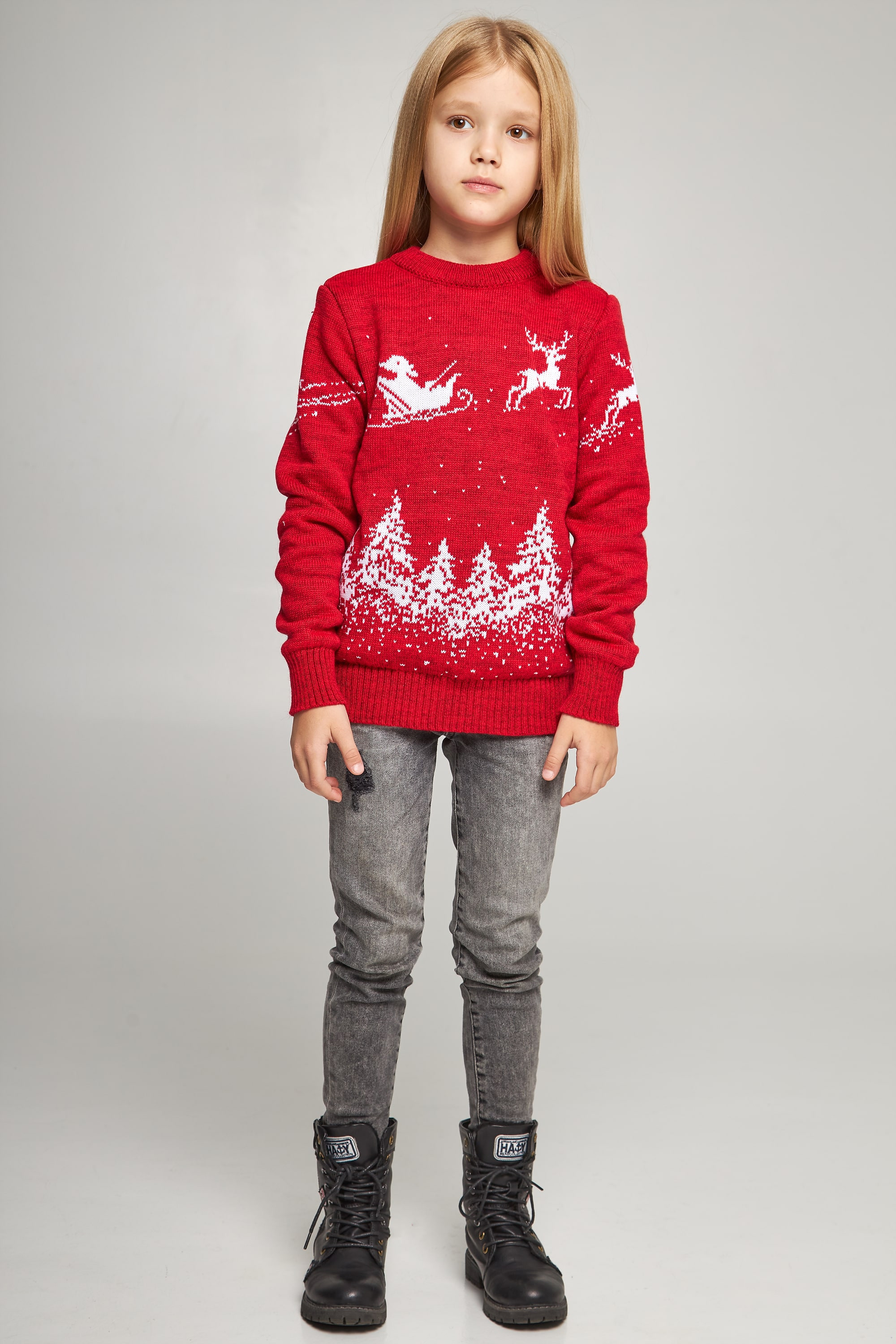 Knitted sweater for a girl Santa Claus with deer red deer