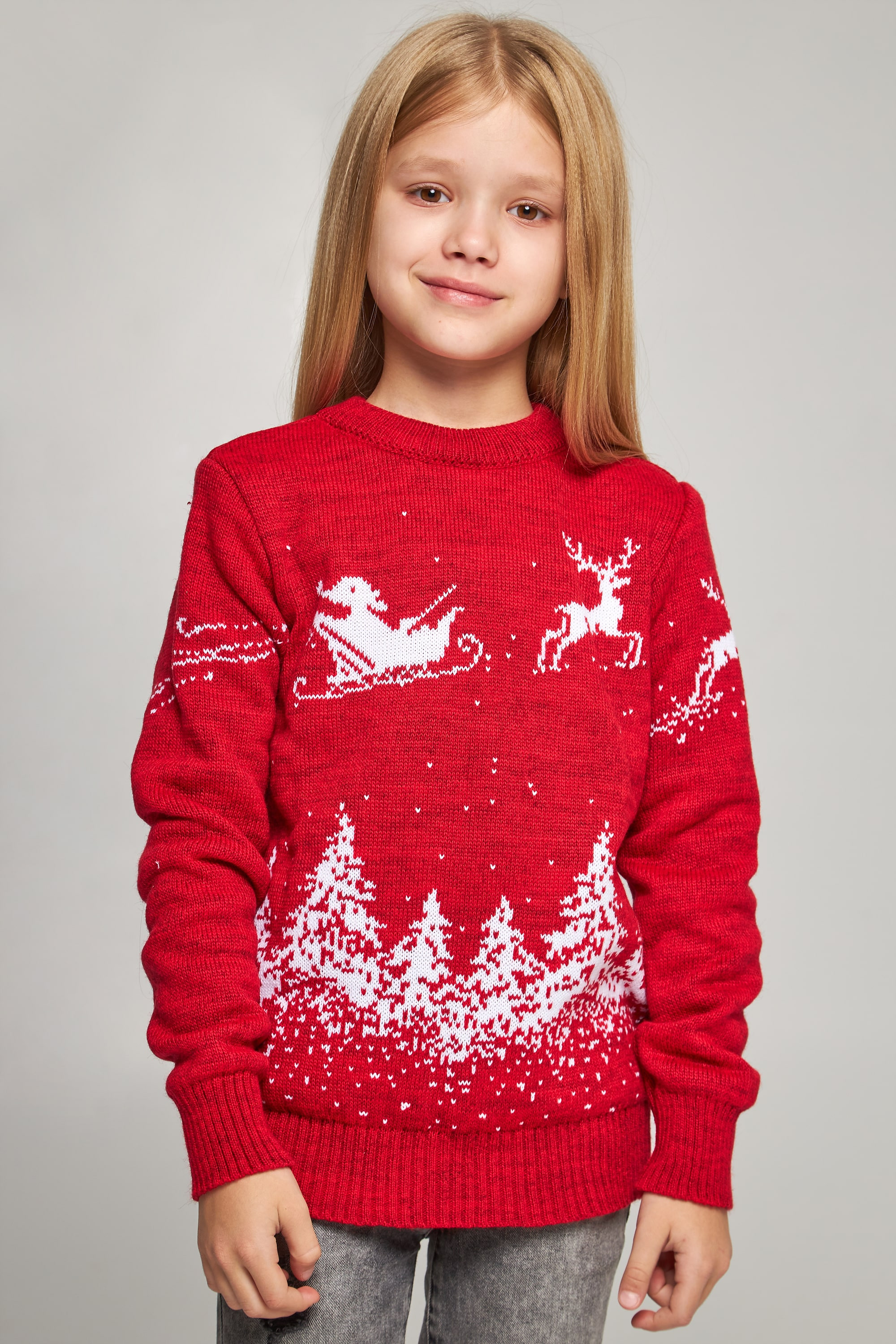 Knitted sweater for a girl Santa Claus with deer red deer