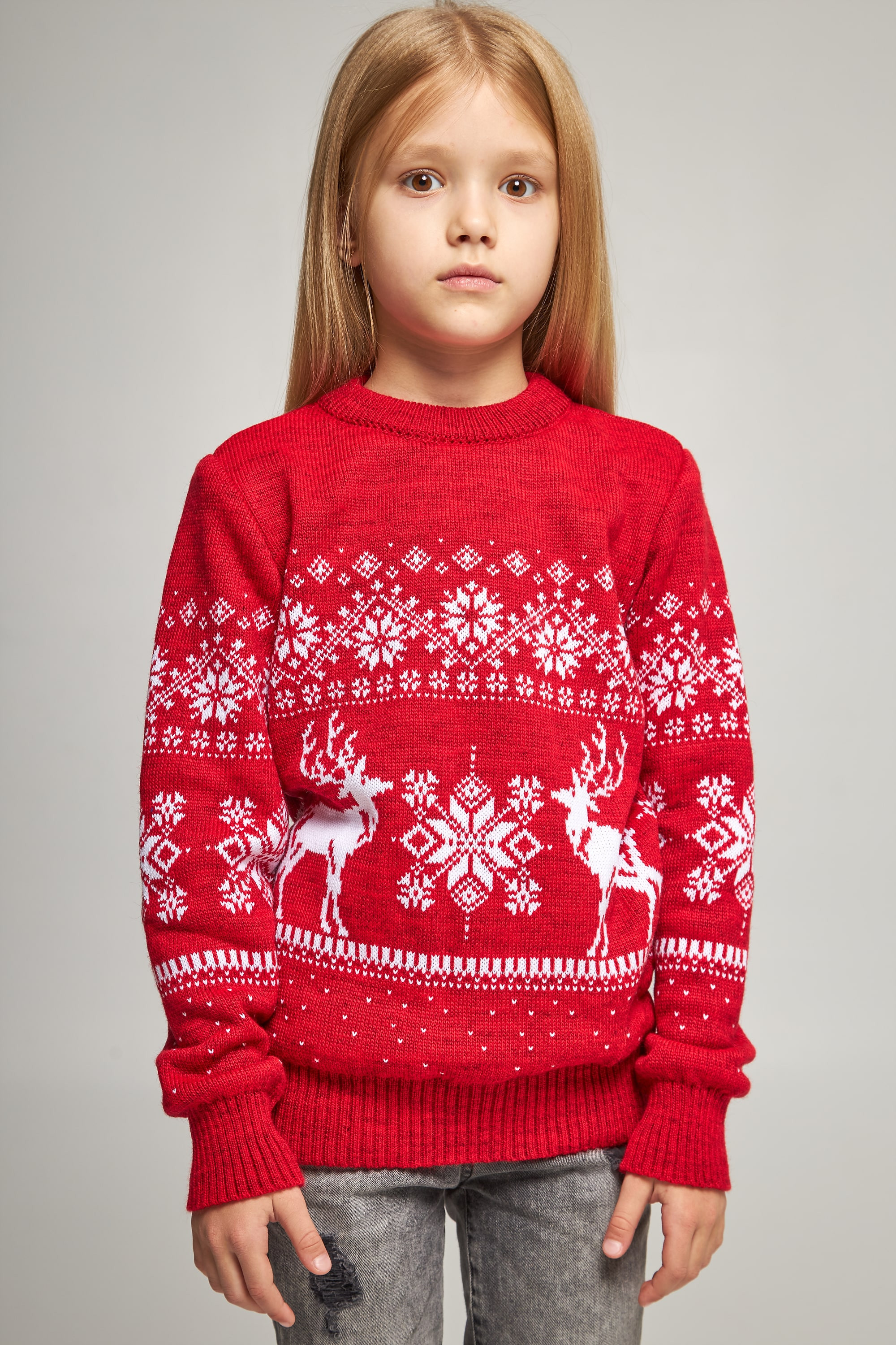 Knitted sweater for a girl snowflakes with deer red deer