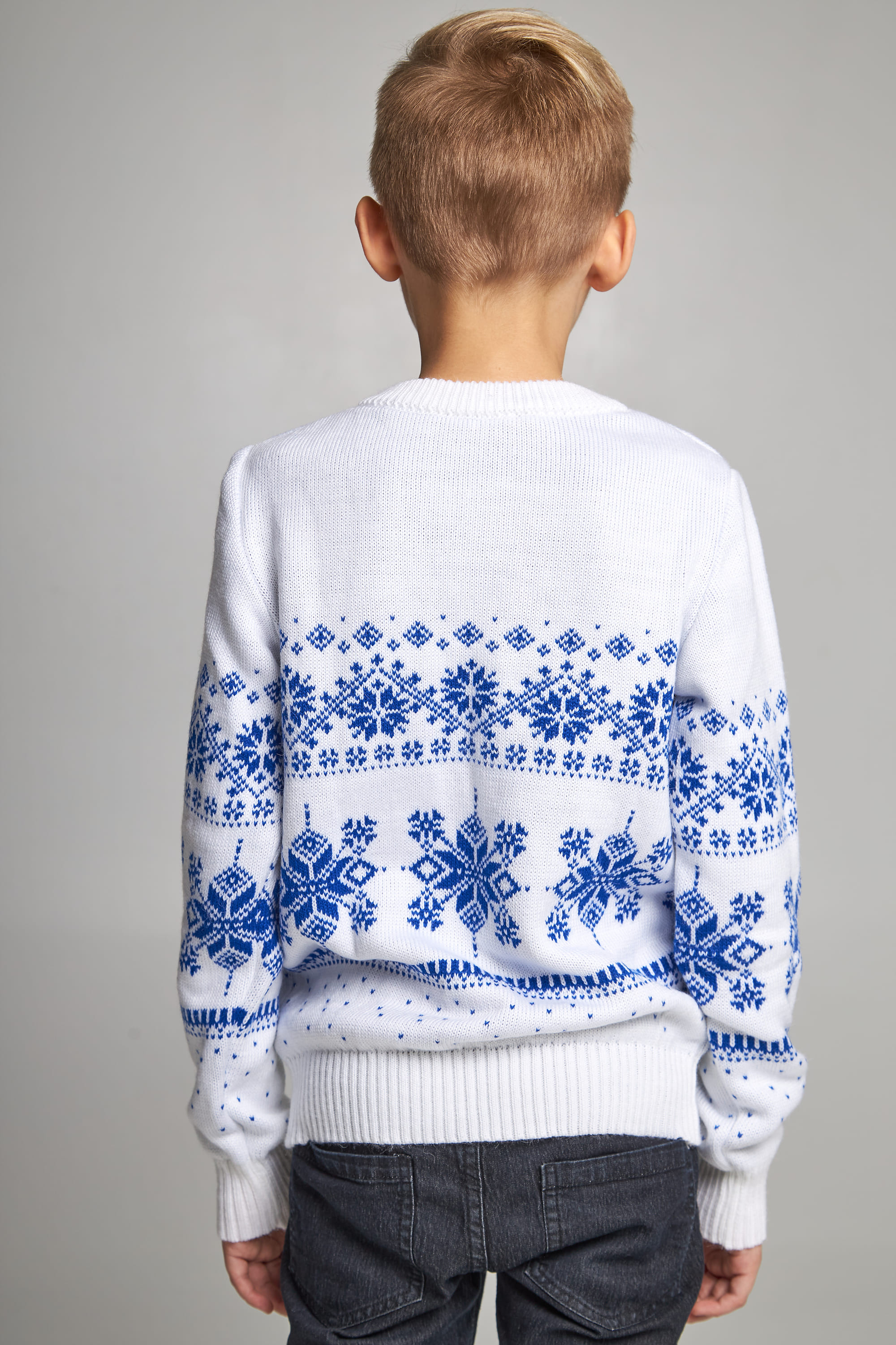 Knitted sweater for a boy snowflakes with deer white Knitted sweater for a boy snowflakes with deer white