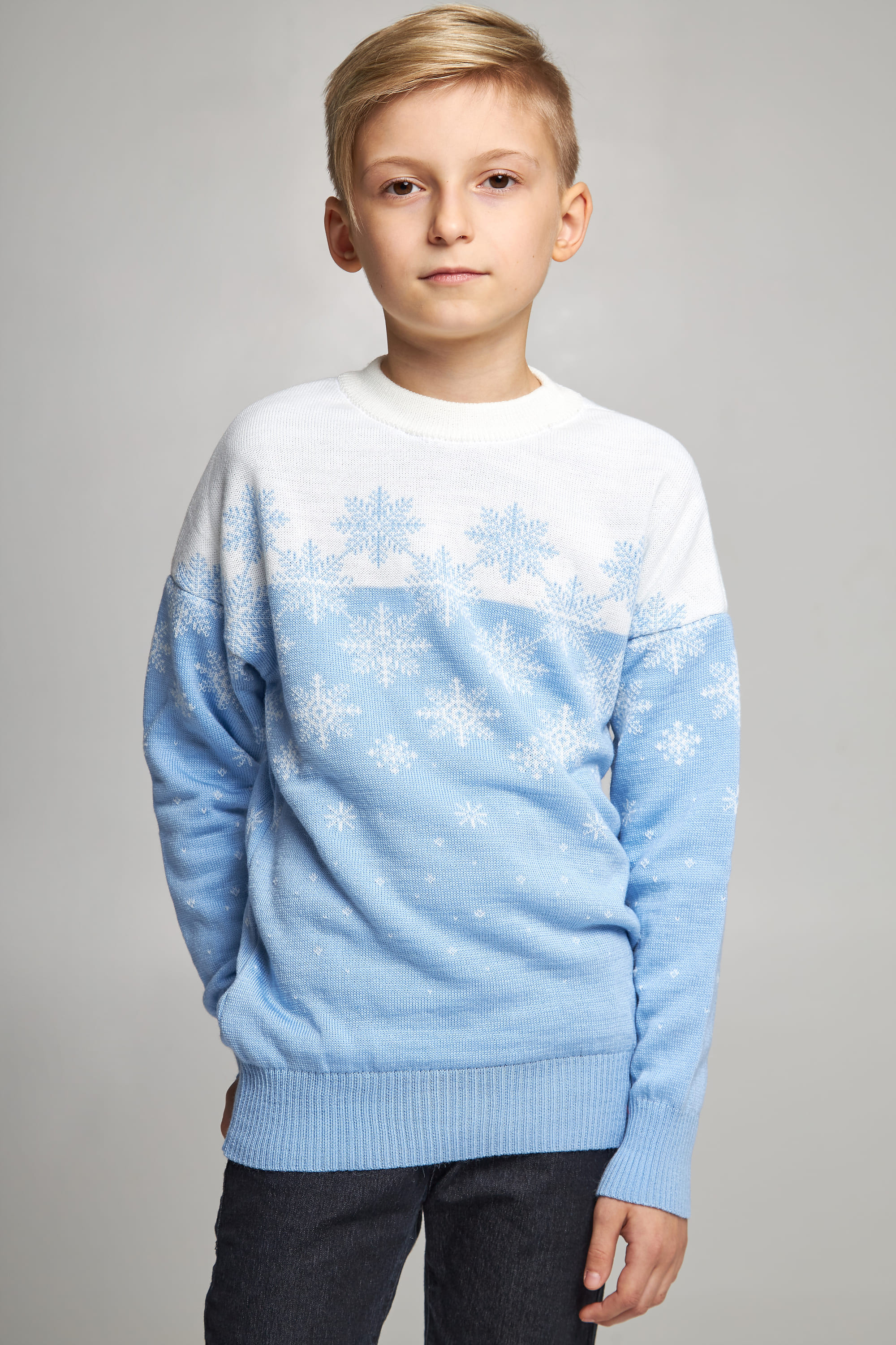 Knitted sweater for a boy Blue snowflakes
