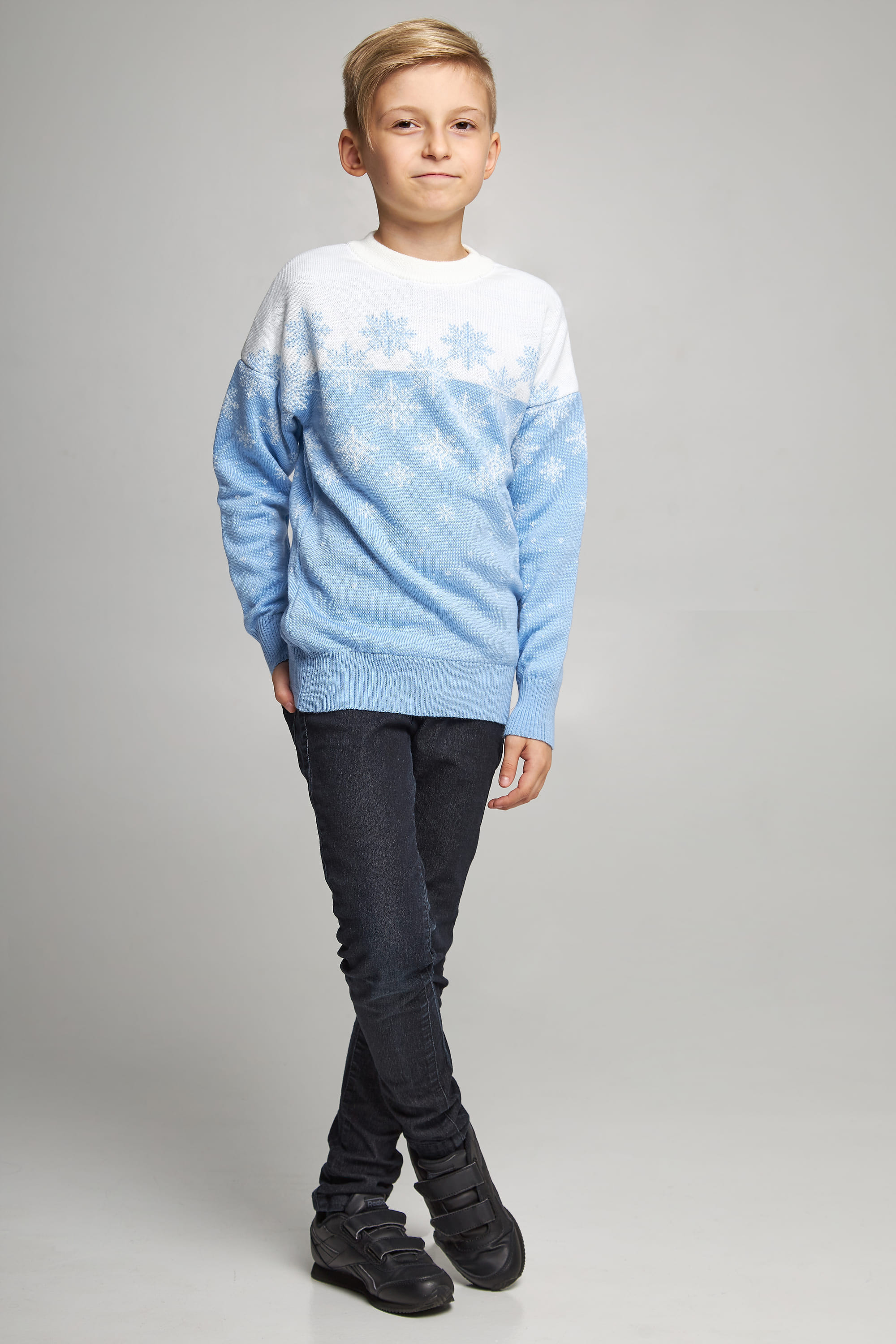 Knitted sweater for a boy Blue snowflakes