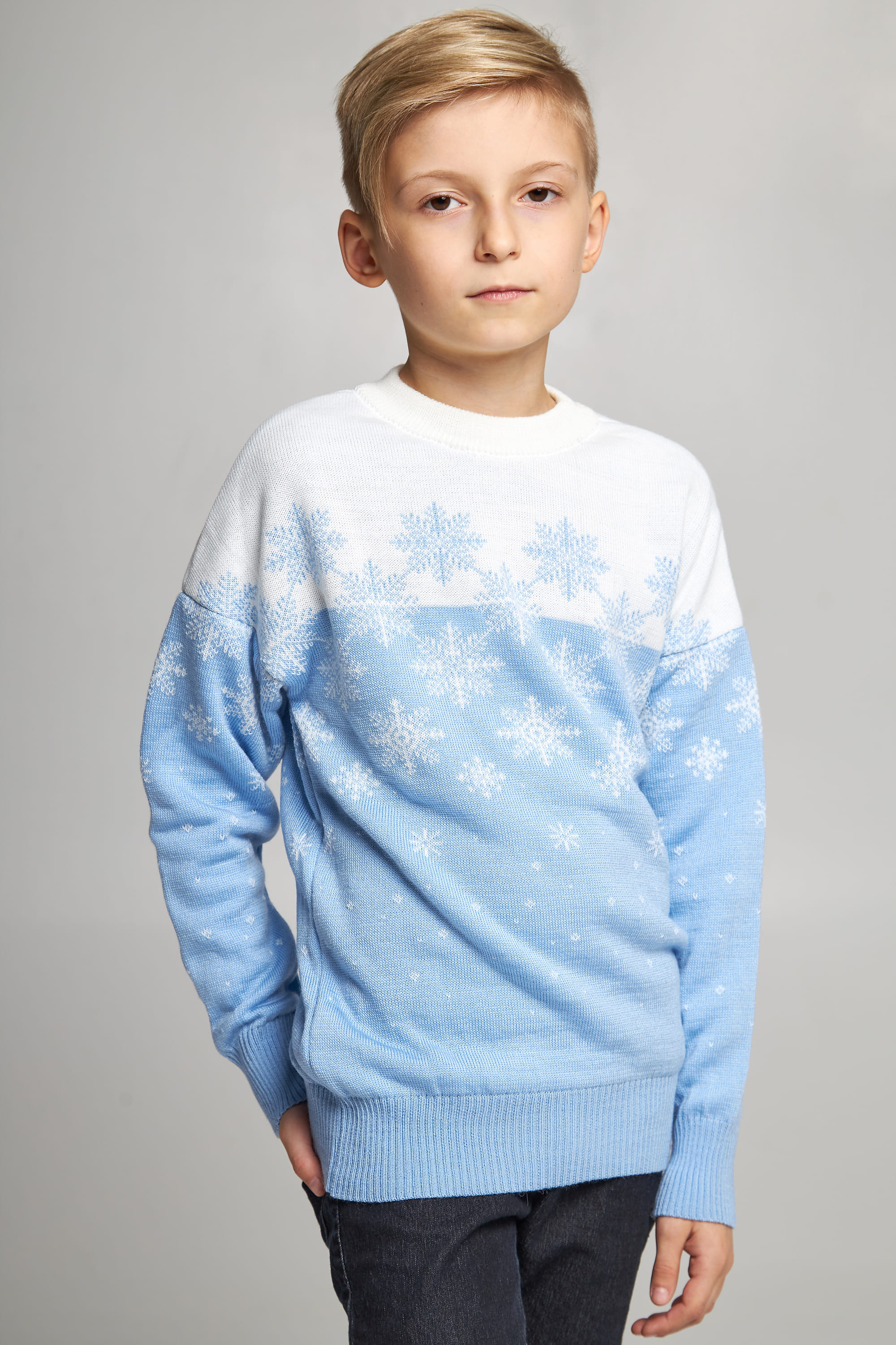 Knitted sweater for a boy Blue snowflakes