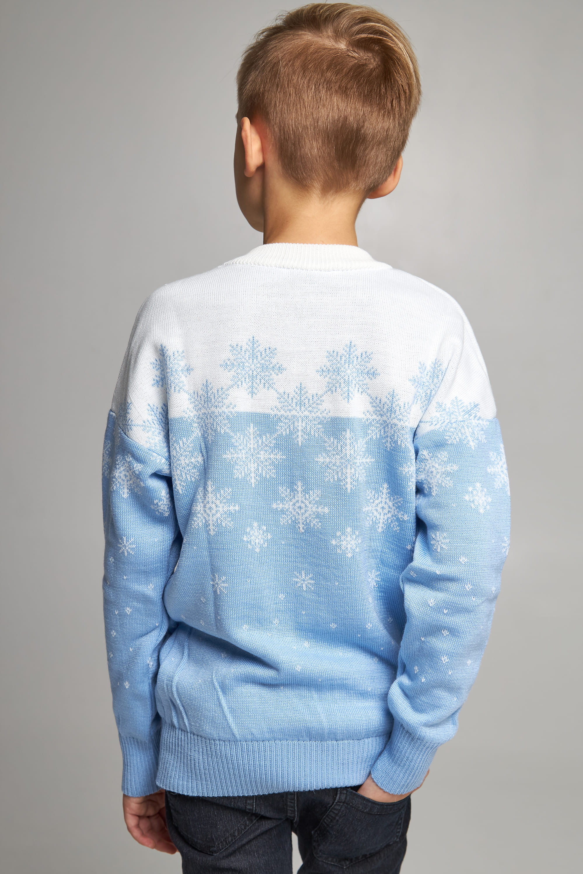 Knitted sweater for a boy Blue snowflakes