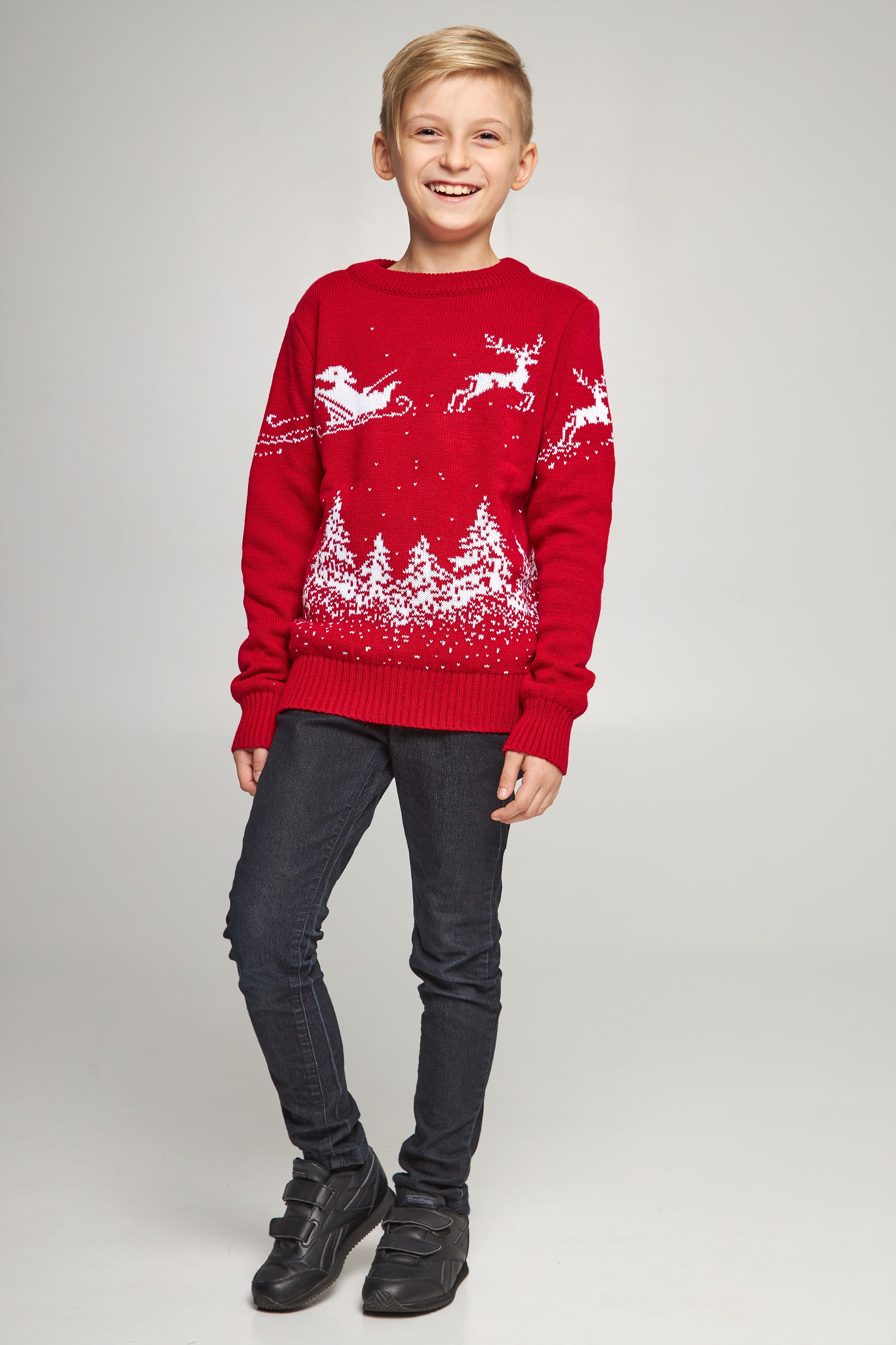 New Year's knitted children's sweaters for two Santa Claus with deer red
