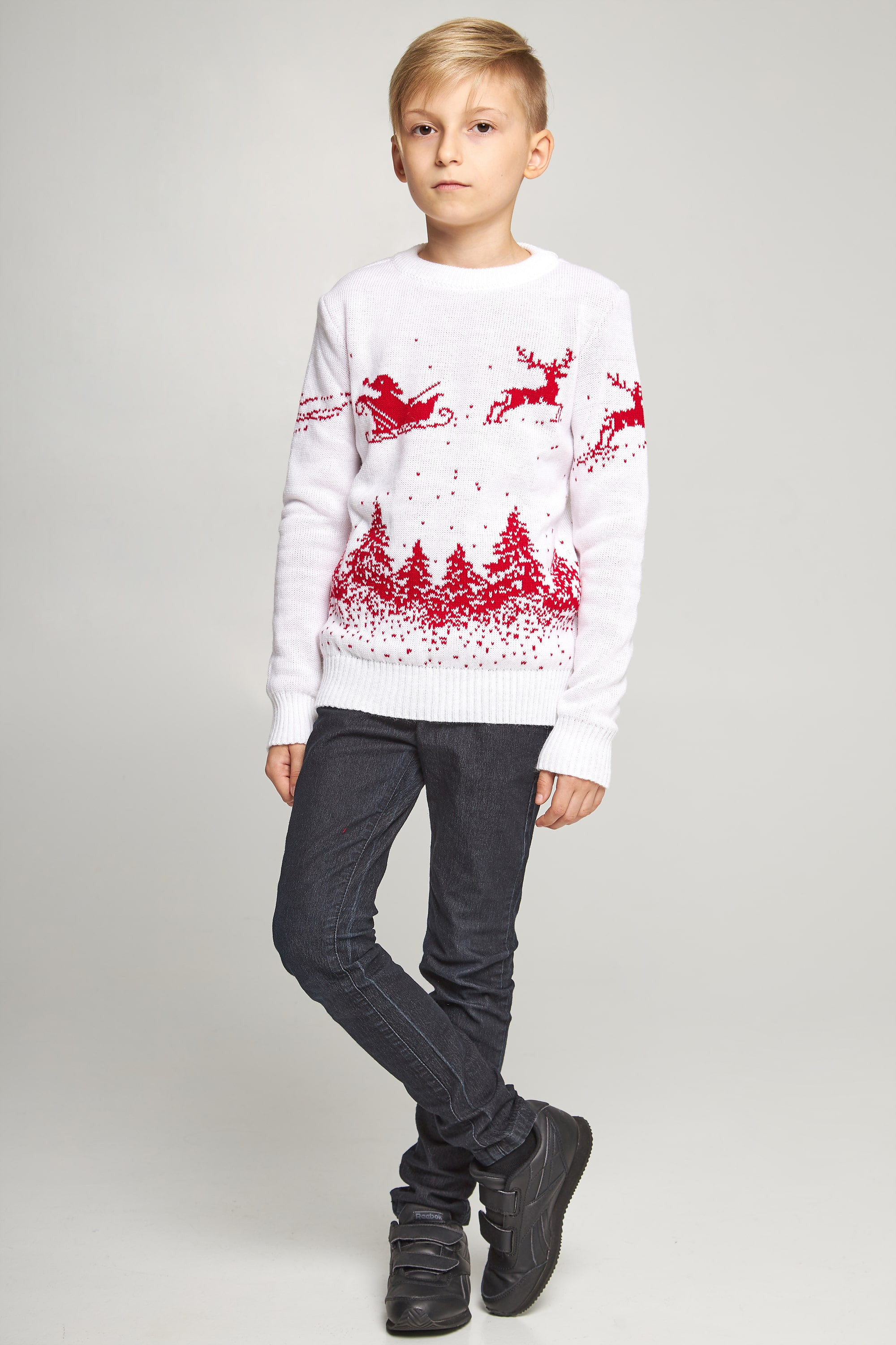 New Year's knitted children's sweaters for two Santa Claus with deer white