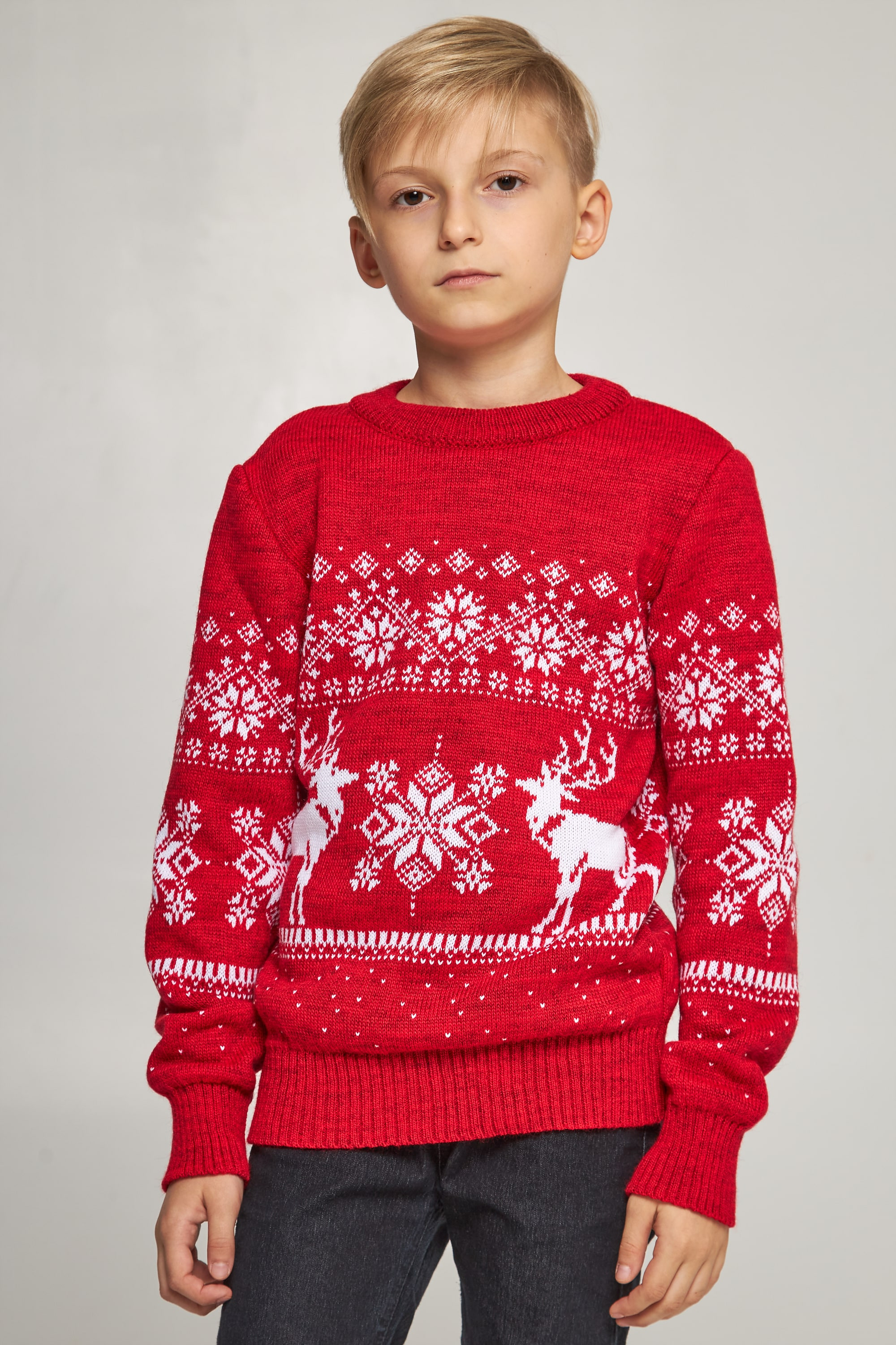Knitted sweater for a boy Santa Claus with deer red deer
