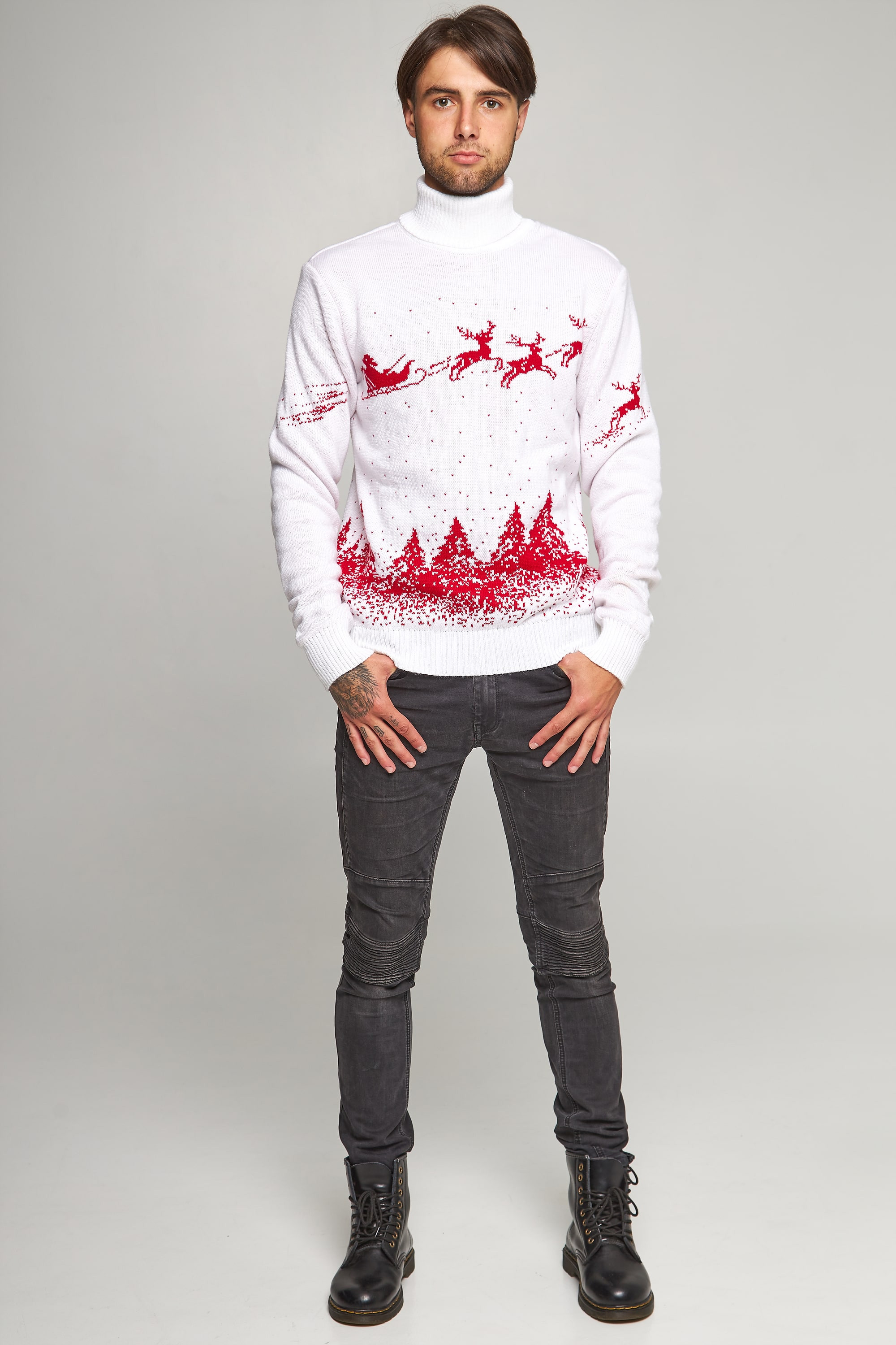 New Year's knitted golfs for two Santa Claus with deer