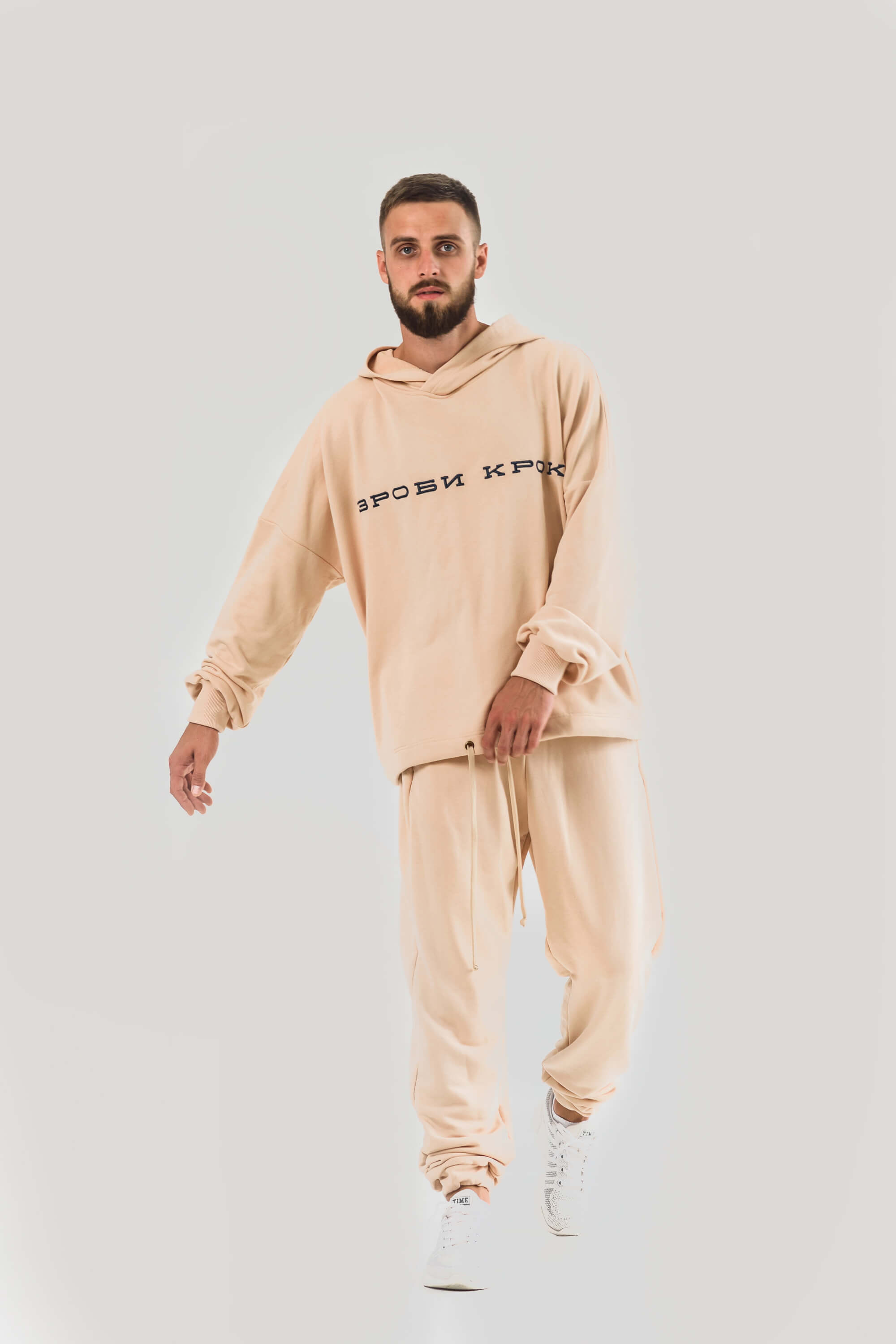 The costume is light beige