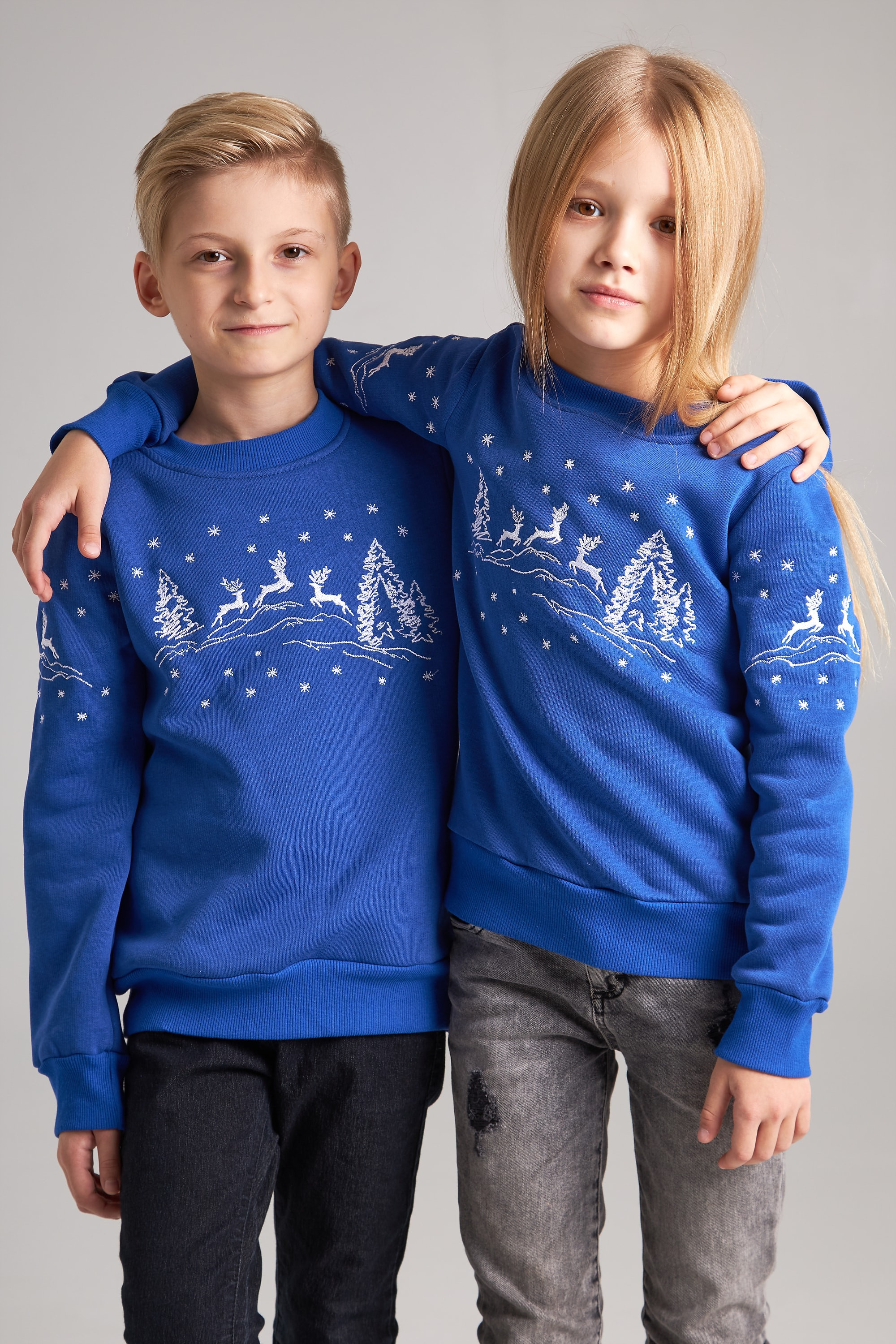New Year's children's sweaters for two with deer blue
