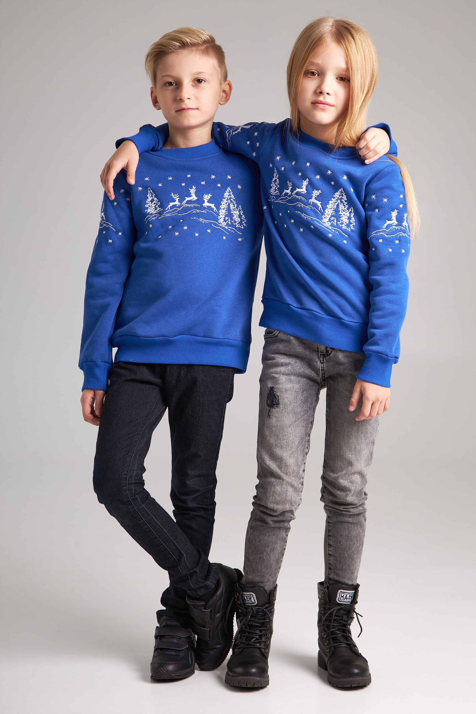 New Year's children's sweaters for two with deer blue