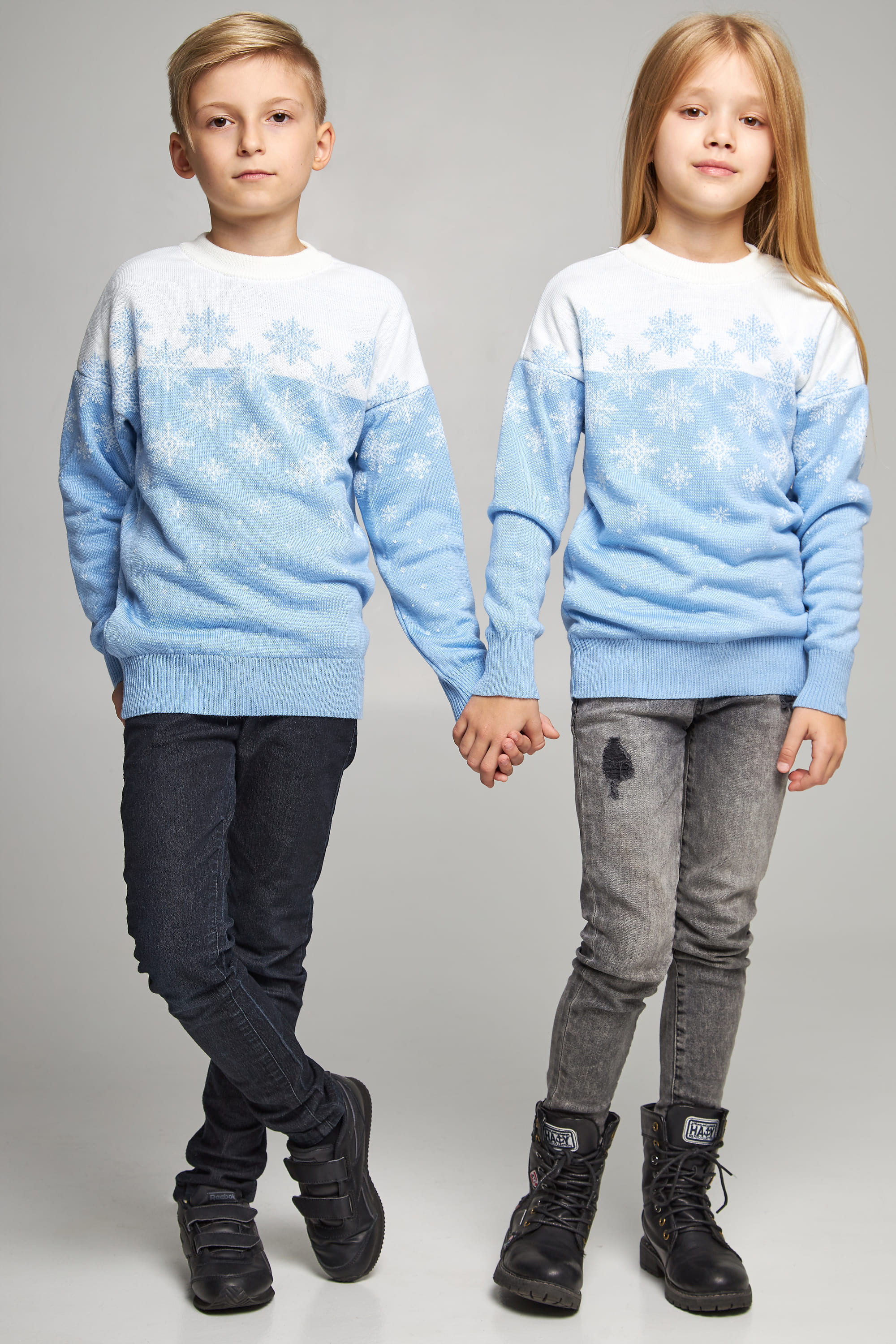 New Year's knitted children's sweaters for two snowflakes blue