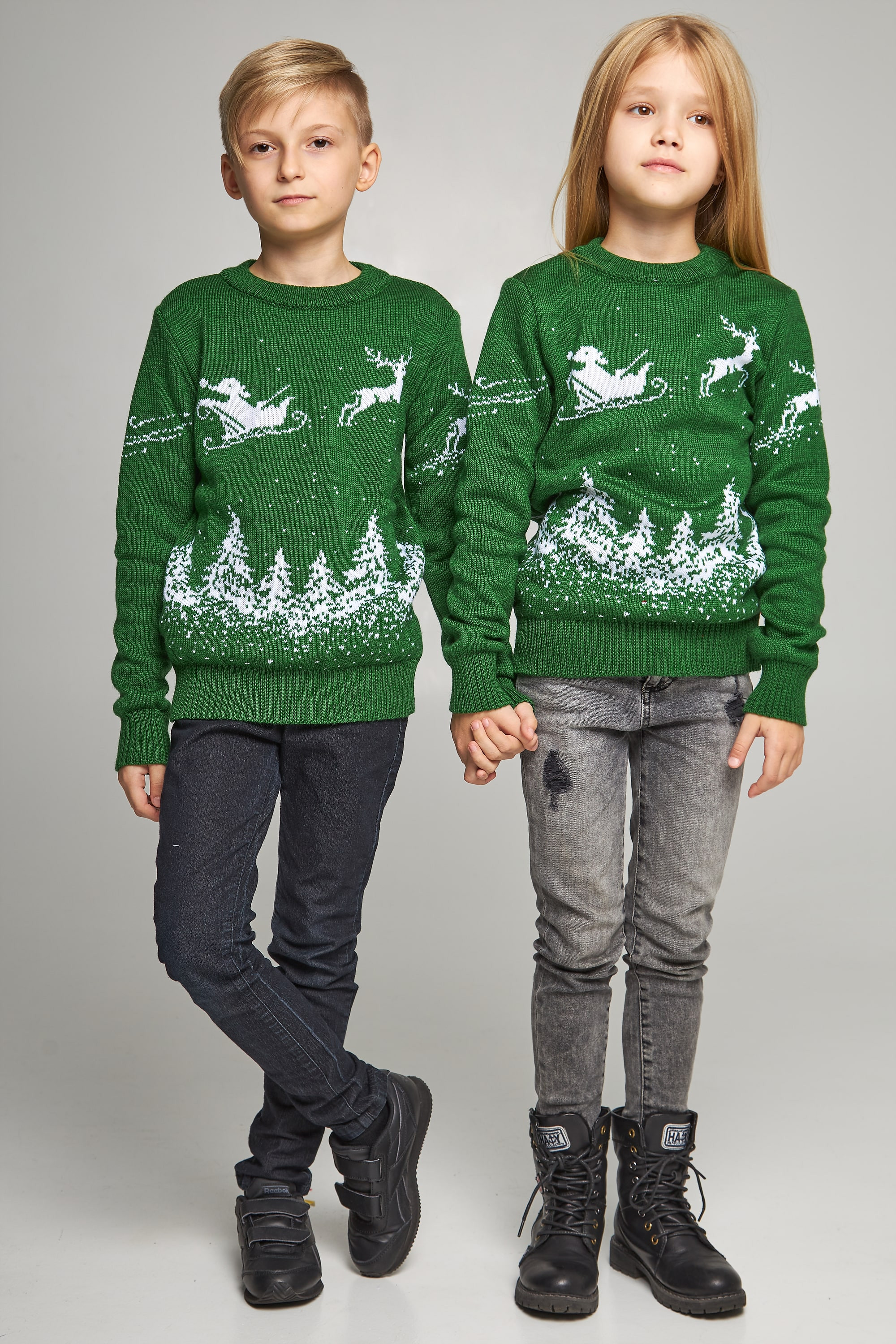 New Year's knitted children's sweaters for two with deer green