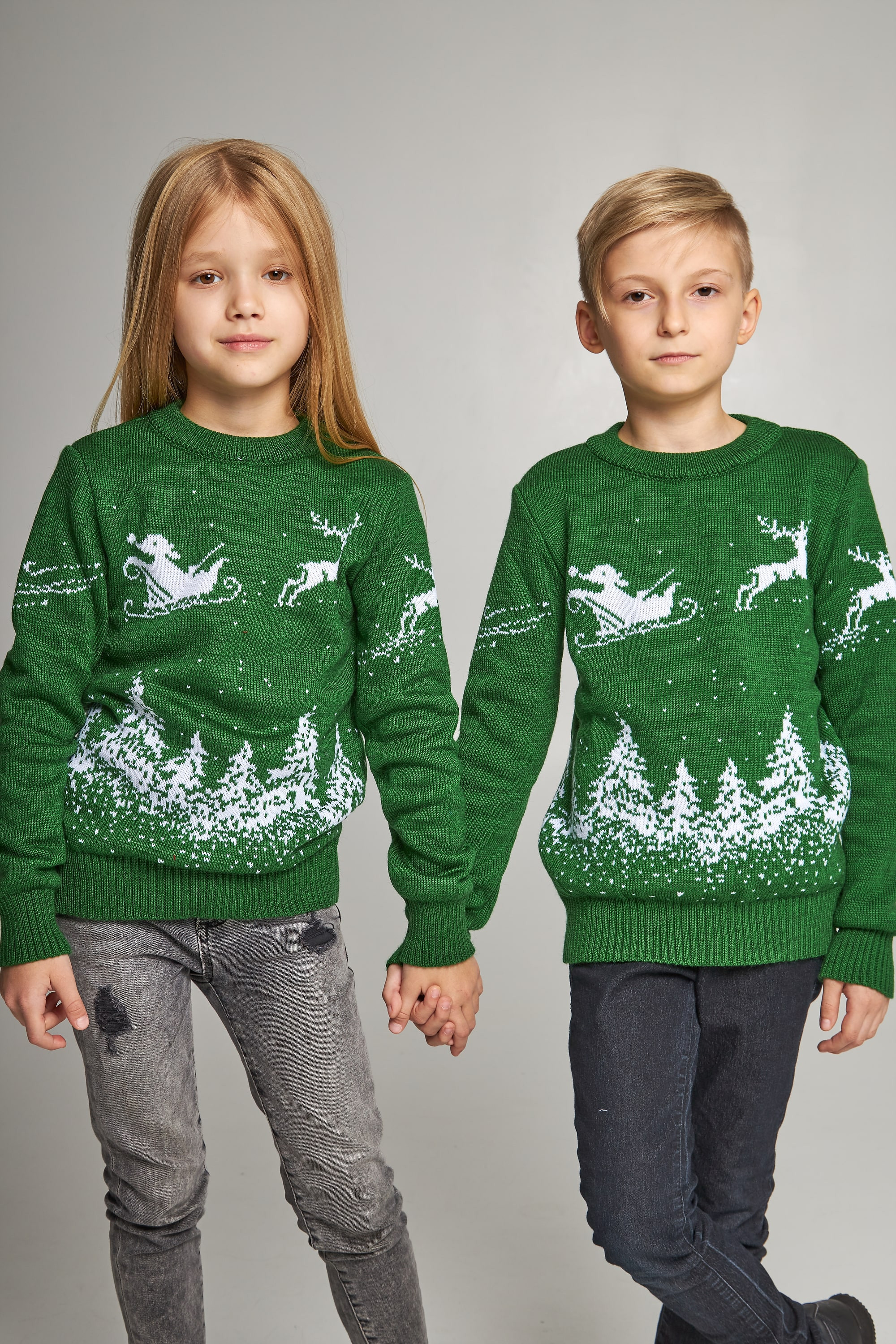 New Year's knitted children's sweaters for two with deer green