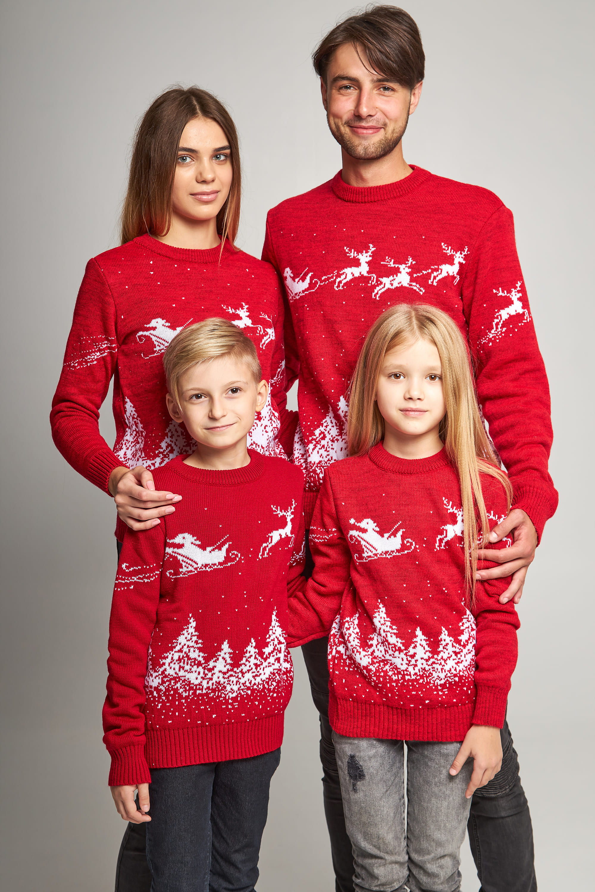 Family knitted Christmas sweaters with Santa Claus Red