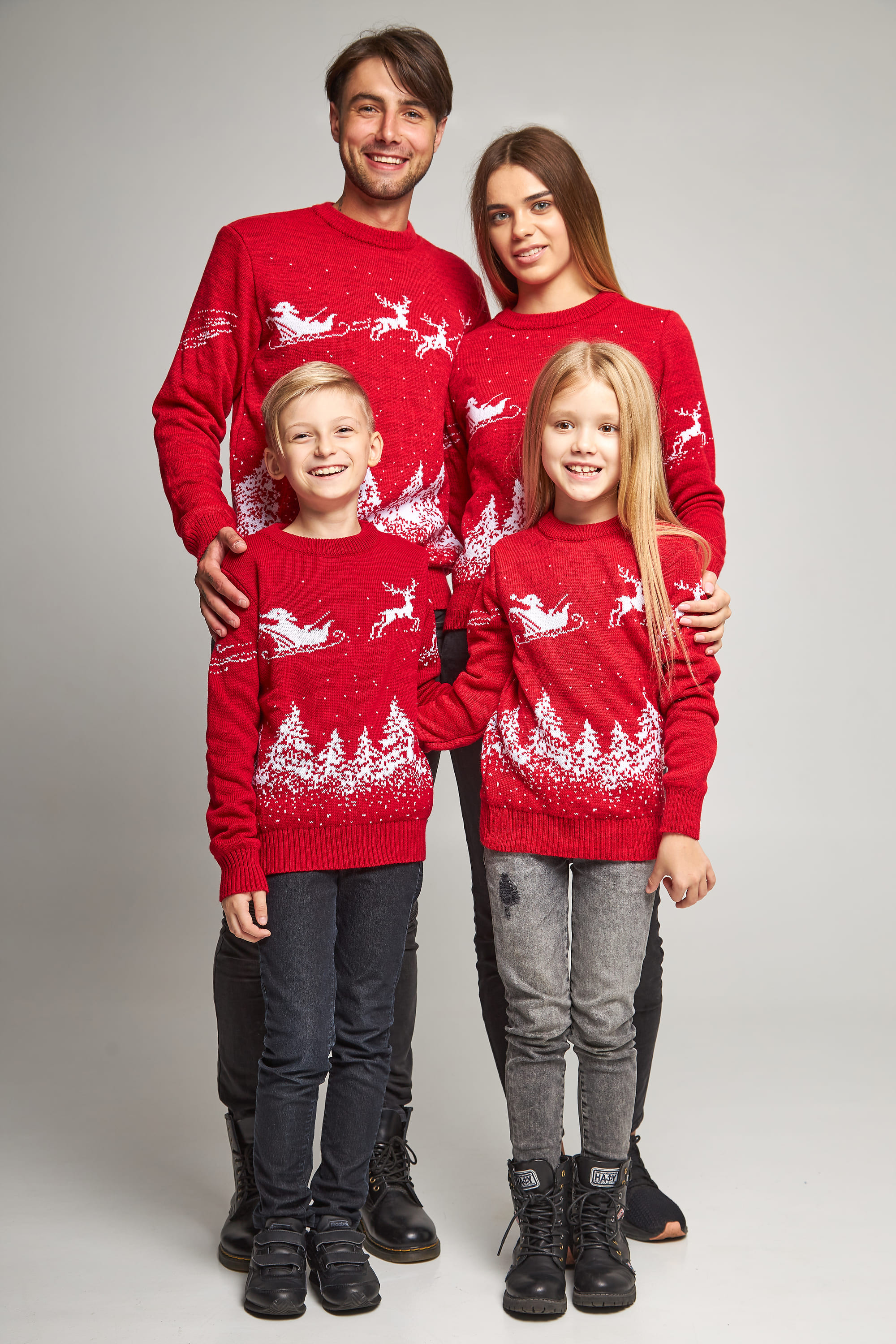 Family knitted Christmas sweaters with Santa Claus Red