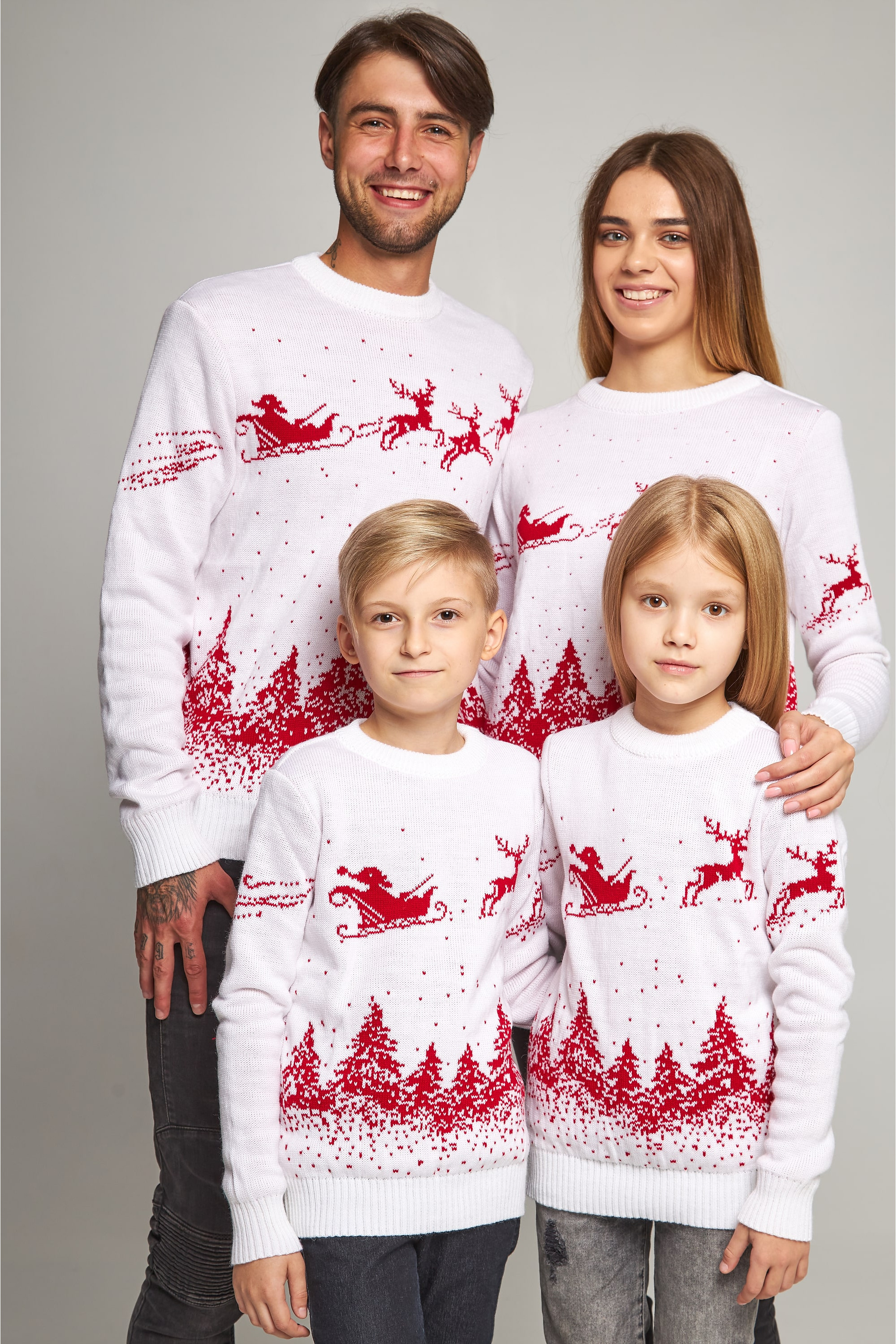 Family knitted Christmas sweaters with deer white