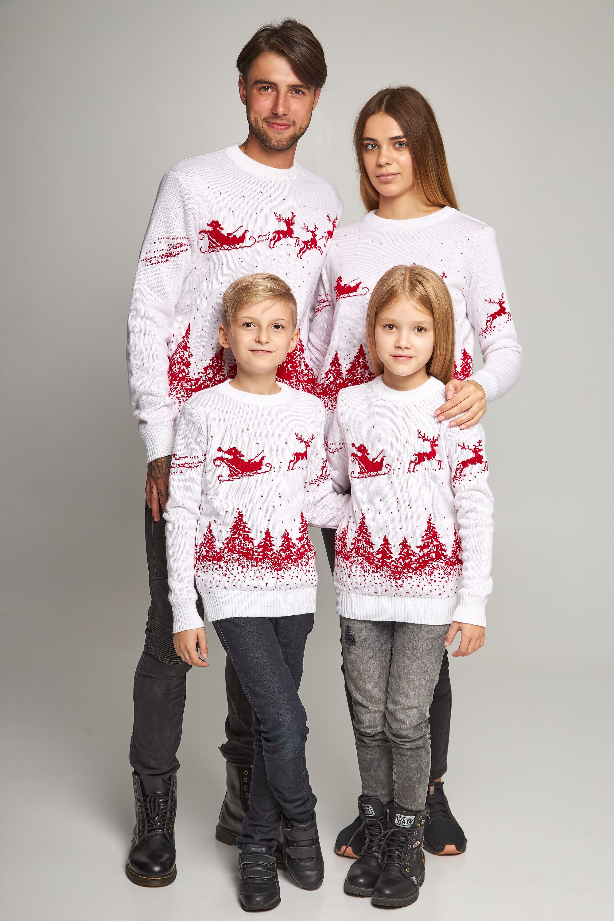 Family knitted Christmas sweaters with deer white