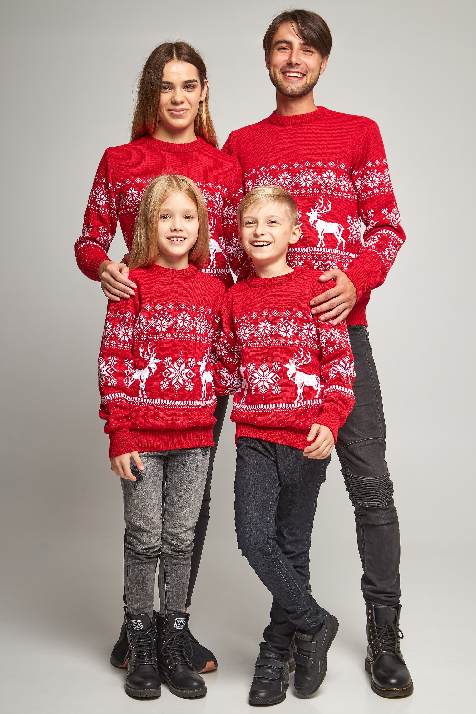 Family knitted Christmas sweaters snowflakes with deer red