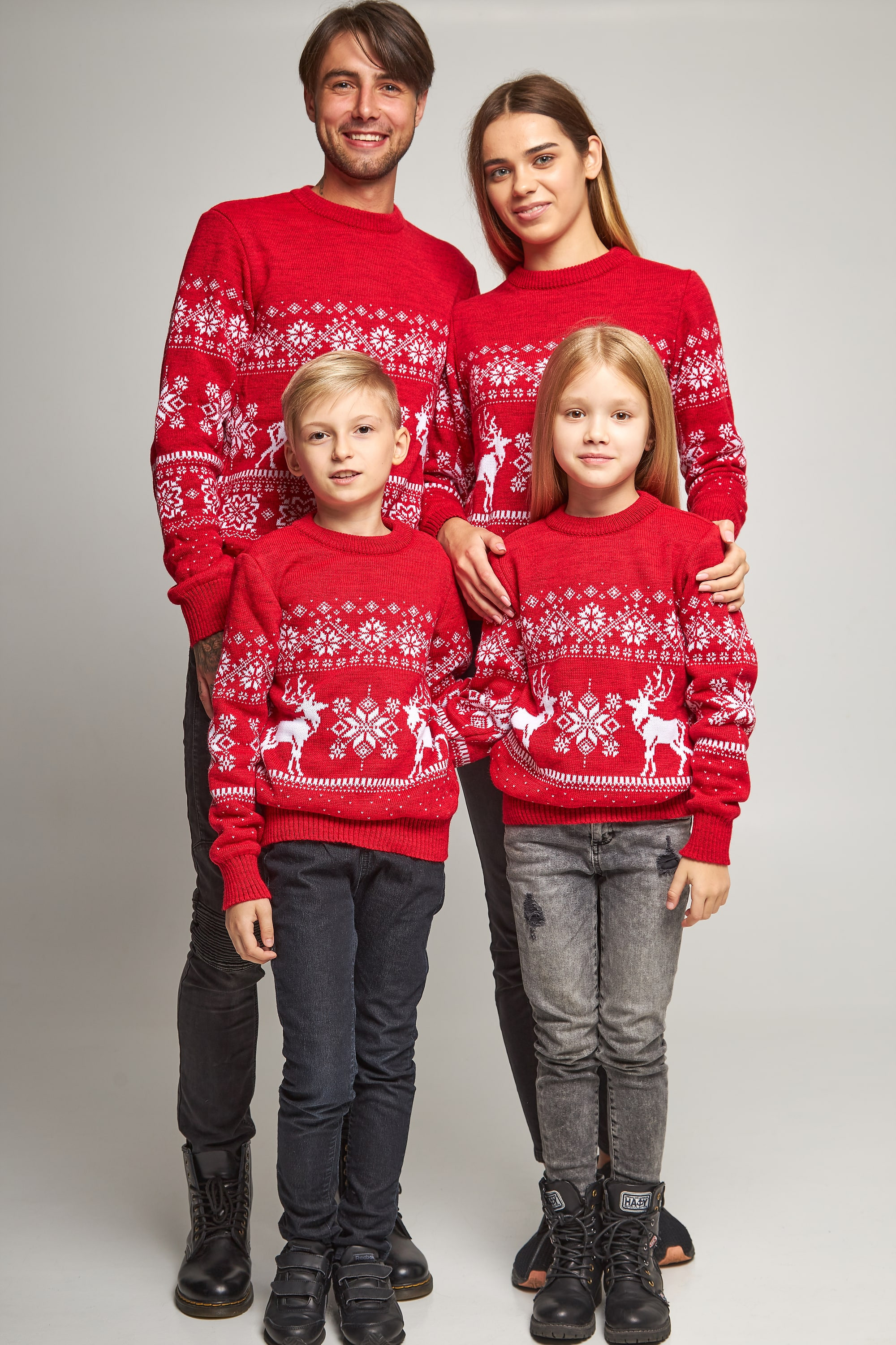 Family knitted Christmas sweaters snowflakes with deer red