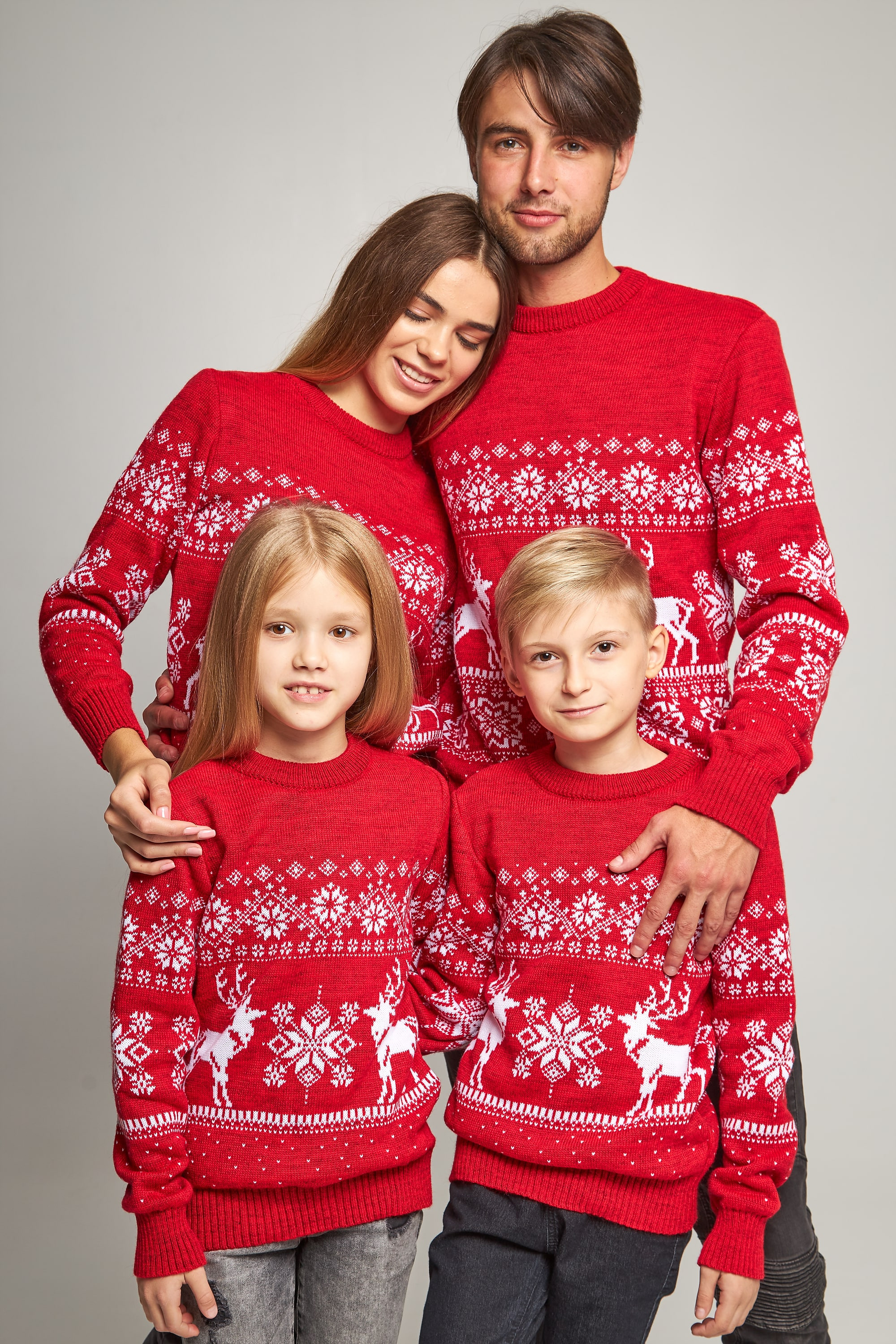 Family knitted Christmas sweaters snowflakes with deer red