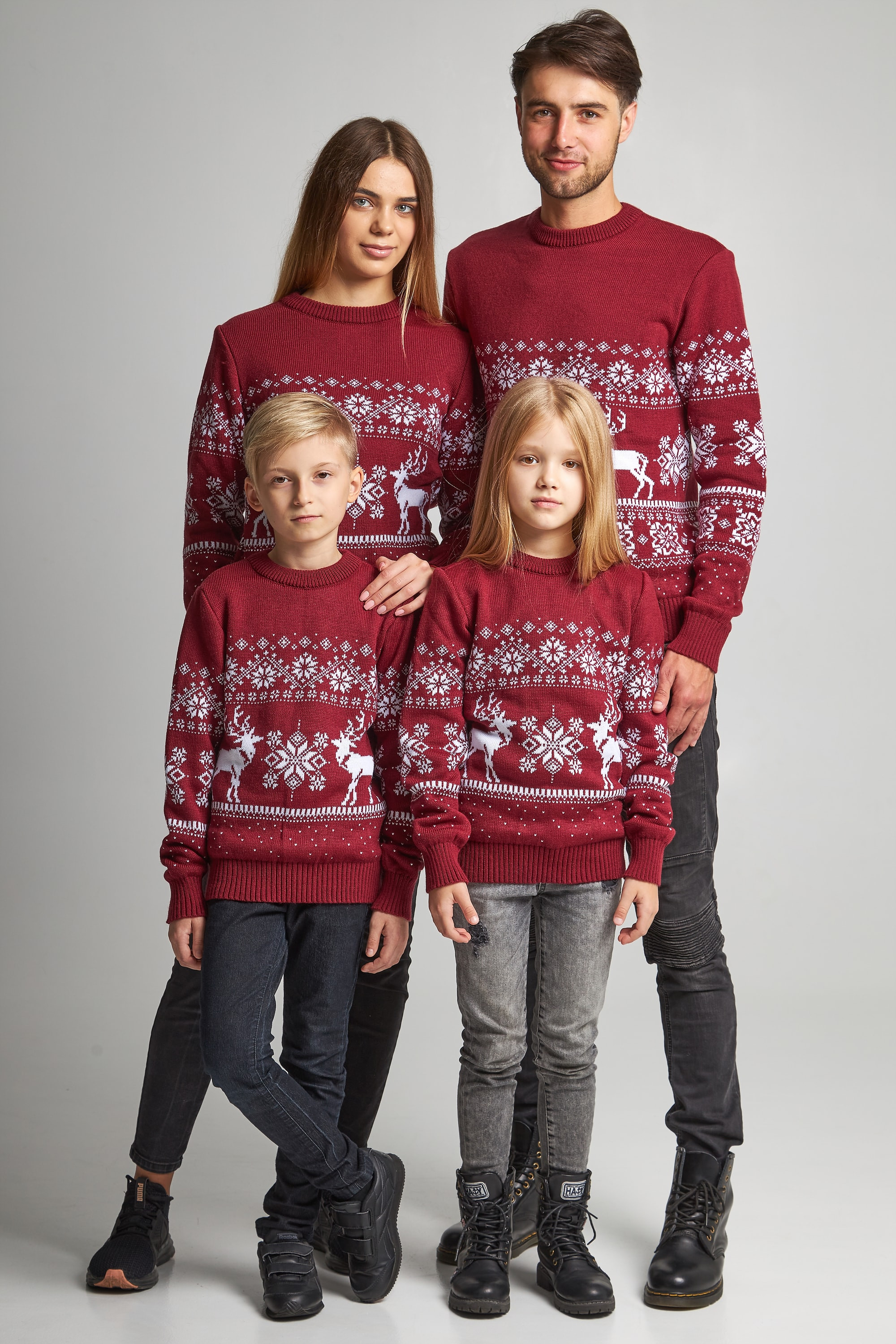 Family knitted Christmas sweaters snowflakes with deer burgundy