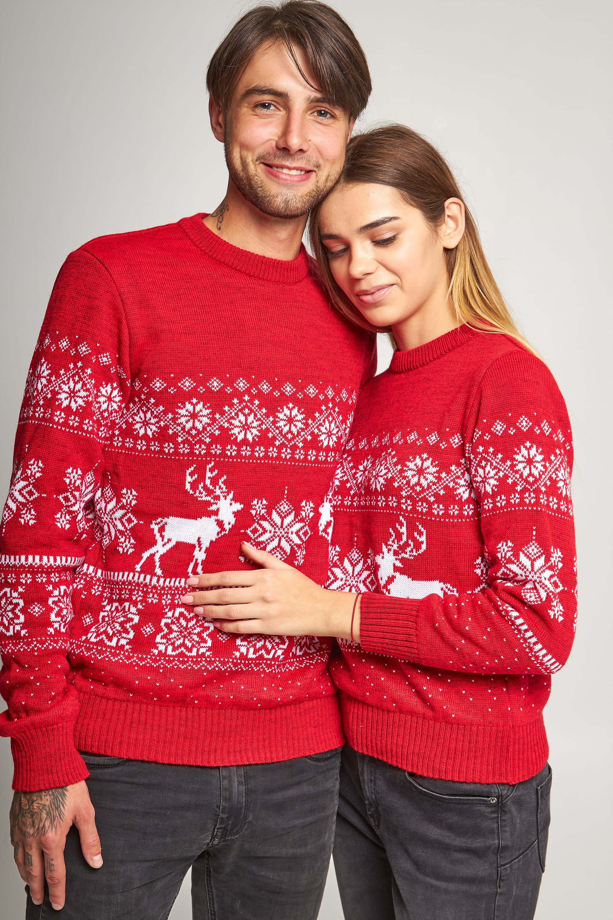 Family knitted Christmas sweaters snowflakes with deer red
