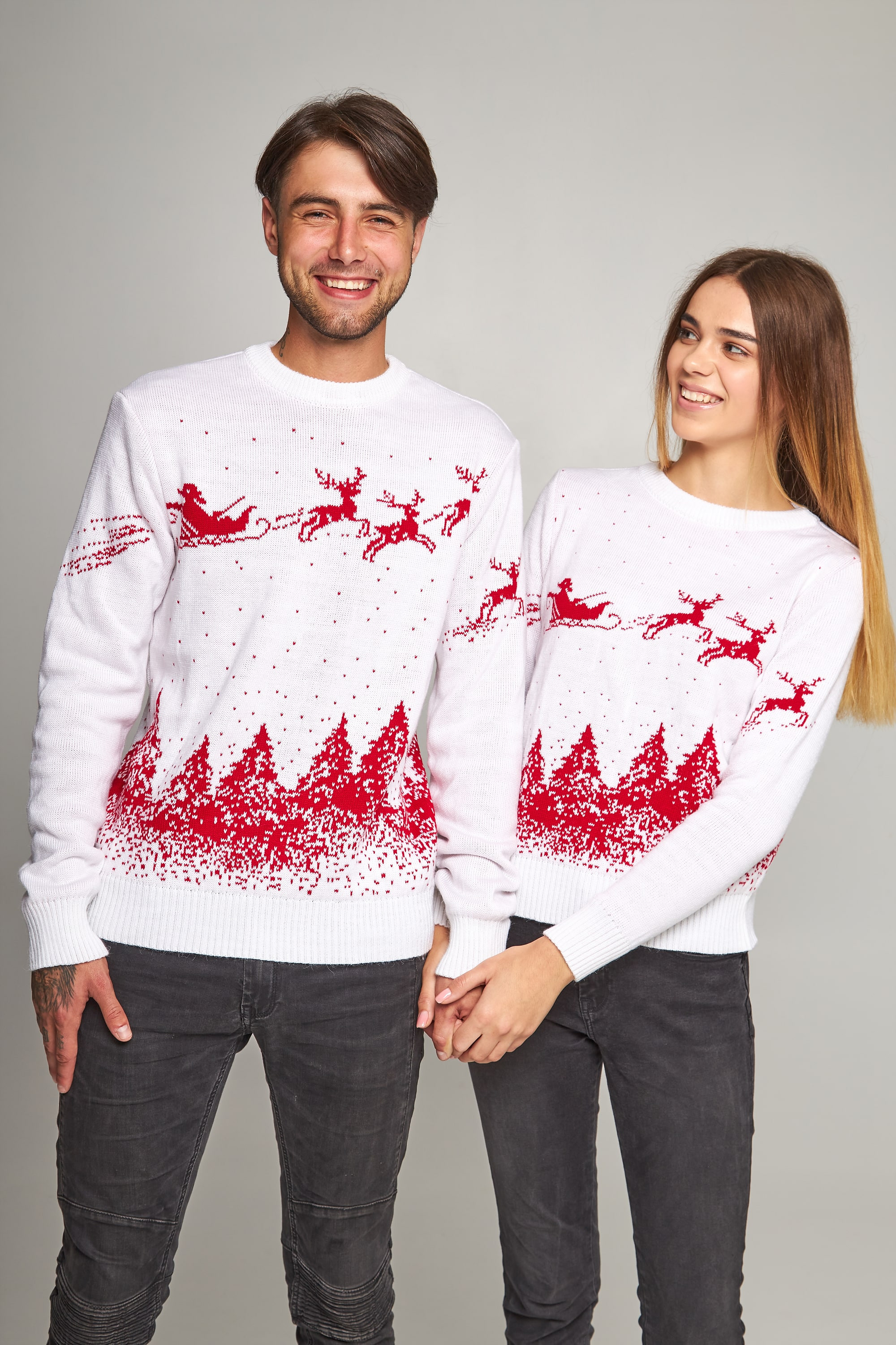 New Year's sweaters for two Santa Claus with deer white