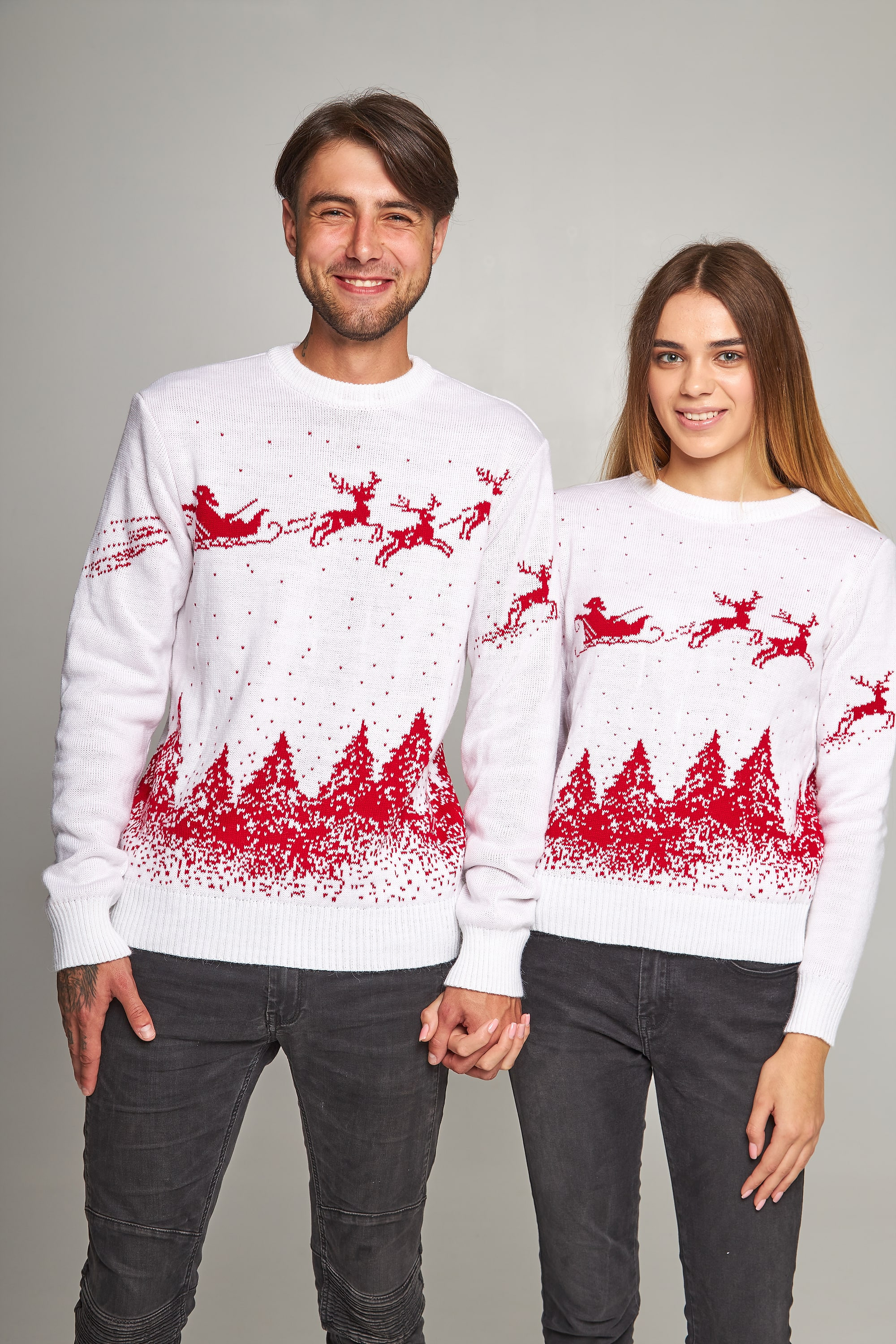 New Year's sweaters for two Santa Claus with deer white