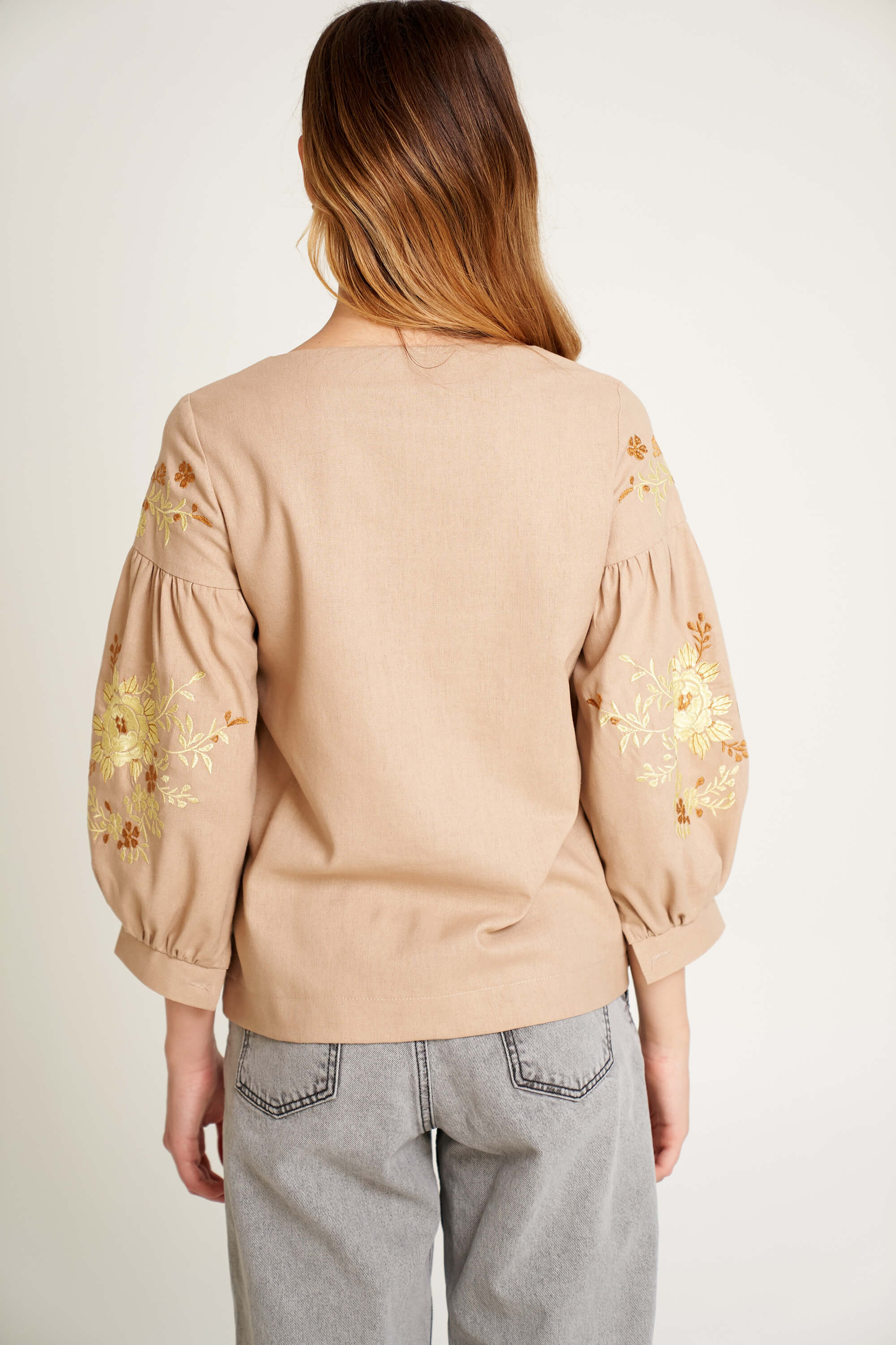 Women's beige blouse with yellow embroidery Women's beige blouse with yellow embroidery